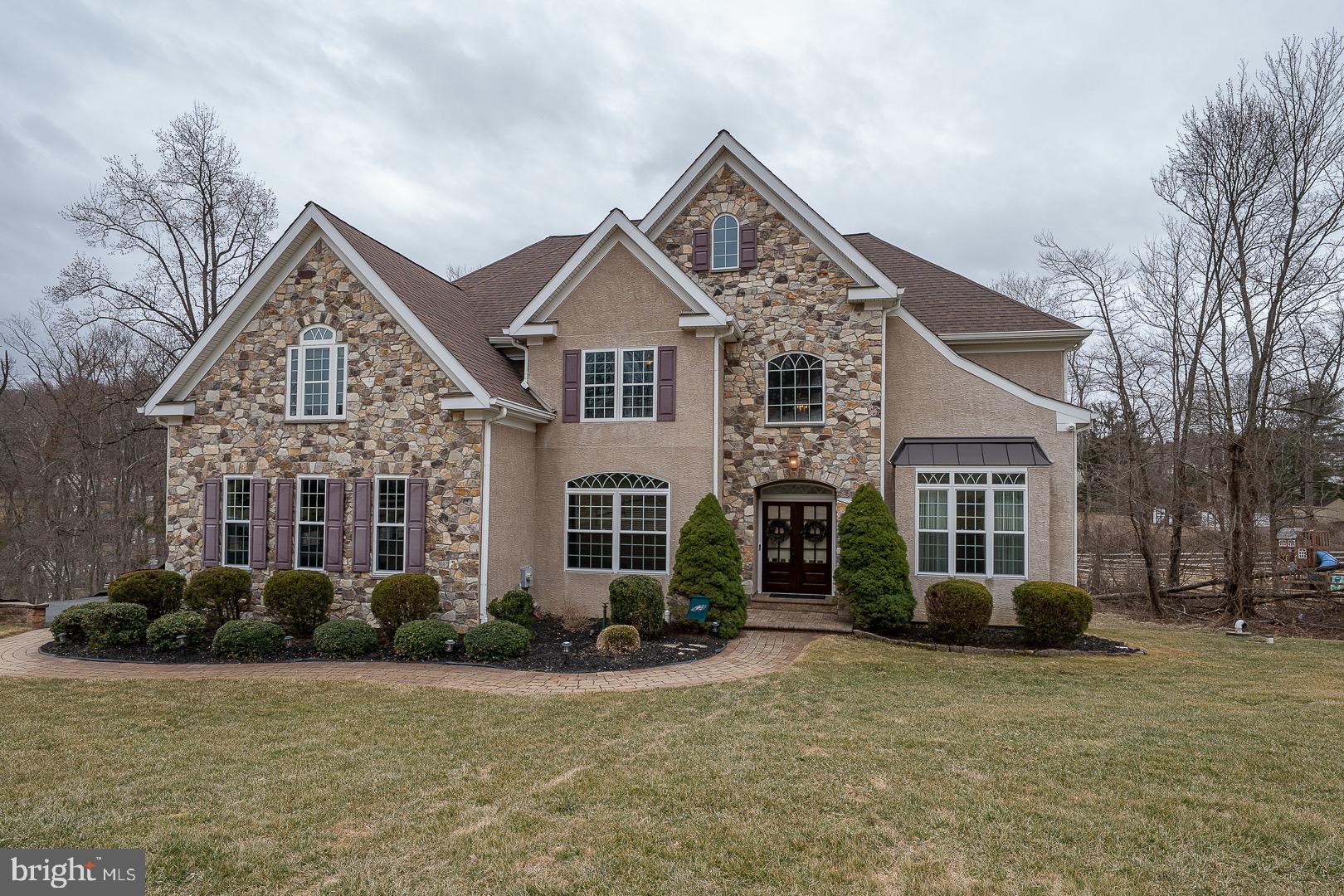 Welcome to 170 Andrien Road, a spectacular home and property tucked away in the heart of Glen Mills. Enter the foyer, which lends itself to a flexible floor plan. The front room is currently functioning as an office, with a full bath and nice size closet. The large living room flows into a beautiful dining room space, with plenty of entertaining space. The heart of the home , gourmet kitchen , large dining area and island leads into a 2 story great room with custom bookshelves. Patio doors lead to a large deck, ample space for outside entertainment.
The second floor boasts a large en-suite , fire place sitting area, his and her closets, soaking tub, radiant heat flooring, plenty of vanity space. The second and third bedrooms share an oversized Jack N Jill bath. The fourth bedroom has a large private bath and all have plenty of closet space.
The lower level has many uses, a beautiful bar for all your entertainment needs, A large seating area to watch the big screen , walk out to a patio, separate bonus room, mechanical room and powder room. Walk the beautifully landscaped grounds to the over sized driveway.
Public record is incorrect, the lot size is approximately 1 acre!
Connection to public sewer will be completed prior to closing .