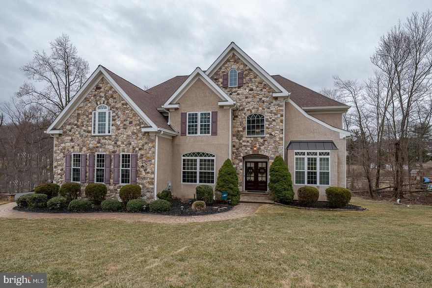 Welcome to 170 Andrien Road, a spectacular home  and property tucked away in the heart of Glen Mills.  Enter the foyer, which lends itself to a flexible floor plan.  The front room is currently functioning as an office, with a full bath and nice size closet. The large living room flows into a beautiful dining room space, with plenty of  entertaining space.   The heart of the home , gourmet kitchen , large dining area and island leads into a 2 story great room with custom bookshelves. Patio doors  lead to a large deck, ample space for outside entertainment.
The second floor boasts a large en-suite , fire place sitting area, his and her closets, soaking tub, radiant heat flooring,  plenty of vanity space. The second and third bedrooms  share  an oversized Jack N Jill bath. The fourth bedroom has a large private bath and all have plenty of closet space.
The lower level has many uses, a beautiful bar  for all your entertainment needs,  A large seating area to watch the big screen , walk out to a patio,  separate bonus room, mechanical room and powder room.  Walk the beautifully landscaped grounds to the over sized  driveway.
Public record is incorrect, the lot size is approximately 1 acre!
Connection to public sewer will be completed prior to closing .