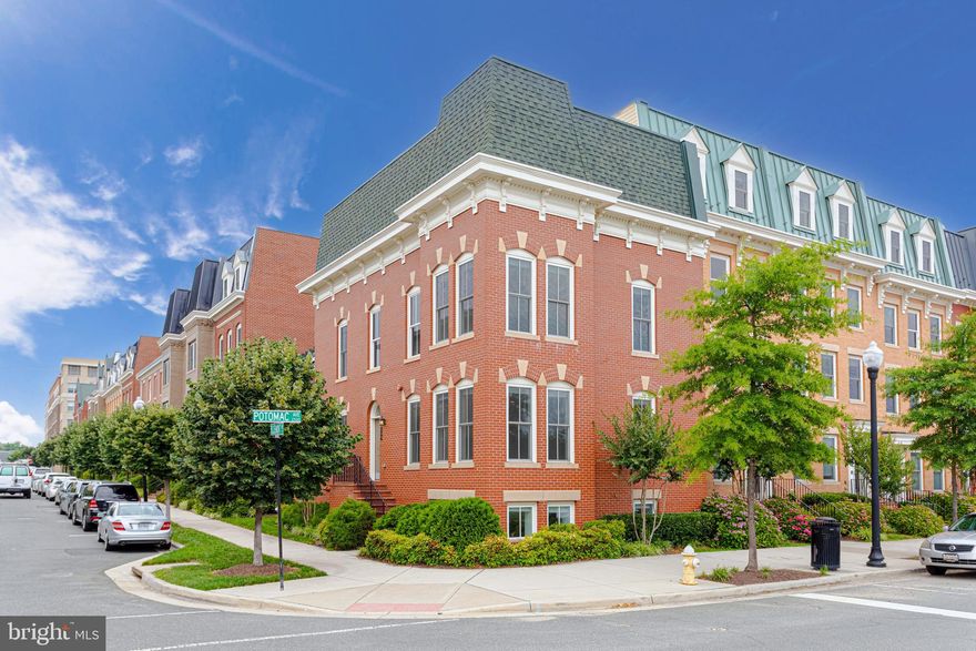 Standing proudly on the corner of Bluemont and Potomac Ave, this end of the row townhouse shines as a testament to why Potomac Yard is such a desirable place. With the only basement in the community, a detached, two car garage, 5 bedrooms, 4.5 bathrooms, and a full, detached guest suite with a wet bar, 738 Bluemont Ave has everything and more. The main level features a fully open floor plan with a spacious kitchen, expansive island, and wine fridge alongside a large living room. Upstairs, there is ample closet space alongside the washer/dryer conveniently located between the three bedrooms. The owners suite features two walk in closets. Downstairs in the windowed basement there is another open den area that leads to ample storage space, bathroom, and bedroom. A subtle balance between entertaining and privacy is struck not only in the basement, but in the detached studio suite above the garage. With a sink, fridge, bathroom, and separate HVAC zone, a guest could stay in comfort and privacy separate from the main house. Outside the house is the beautiful neighborhood of Potomac Yard where there is ample access to public transit, public parks, and regular community activities.