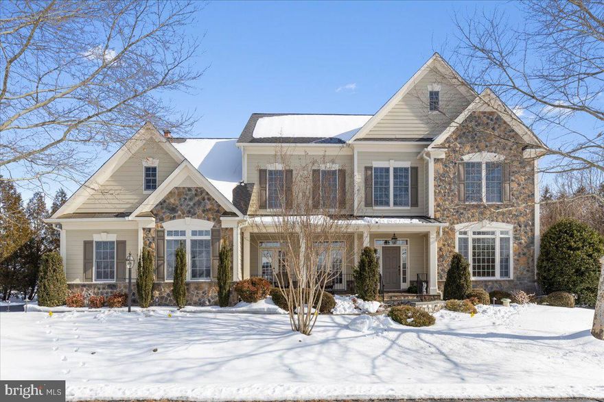 This exceptional estate offers over 8,100 square feet of refined living space on a private homesite surrounded by mature trees and a protected conservancy, ensuring permanent privacy. Designed with a stone-front entrance and durable HardiePlank siding, which was recently repainted for long-term, low-maintenance living. This residence showcases 4 expansive en suite bedrooms, 5 full baths, 1 half bath, a fully finished walkout stairs basement, and a 3-car garage, complemented by a 6-car driveway. A main-level mudroom with 2 closets and a tub was conveniently placed by the garage entrance to the home. Impressive outdoor living features curated lighting, custom flagstone walkways, a covered lighted front porch, screened-in back porch, stone back patio, with a large stone fireplace; all create a serene, retreat-like atmosphere.

Entering your new home, a grand marble floor 2-story foyer, with Schonbek crystal chandeliers, wrought iron balusters, sets an elegant tone, seamlessly transitioning to gleaming hardwood floors across the main level. 10-foot tray and coffered ceilings, alcove niches with accent lighting, and custom millwork elevate the architectural presence throughout the home. Formal living and dining rooms offer refined gathering spaces, while the large private office features built-ins, ideal for working from home. The inviting family room is equipped with a built-in 7.1 surround sound system, fully wired for an immersive audio experience. This room also features a coffered ceiling, stone fireplace, and dual French doors, leading to the screened-in porch. Andersen windows with high-end tinted solar films fill the home with natural light, while custom-designed draperies and height-adjustable cordless shades offer comfort and privacy.

At the heart of the home, the chef’s kitchen offers a large walk-in pantry, expansive island, five-burner cooktop, dual dishwashers, a wet bar, and Bosch and Whirlpool appliances. A sunrise sunroom off the breakfast nook boasts large sun-filled windows and offers a pleasant sight through French doors that flow onto the stone patio. 

The luxurious owner’s suite includes a gas fireplace, tray ceiling, coffee bar, sitting area, and a spa-inspired bath with seamless glass shower, a separate custom-built-in dressing vanity, double sinks, a large tub, plantation shutters, and an impressive walk-in closet designed for two. All secondary bedrooms feature walk-in closets, with soundproof walls throughout all bedrooms and bathrooms, including the half bath for added privacy.

The upper-level laundry room and a large linen closet add everyday convenience. The fully finished walkout basement includes a large flexible den with two large closets (optional 5th bedroom), two large enclosed bonus rooms, a recreation and fitness area, and a cozy TV enclave area with a gas fireplace, for entertainment, and large French doors to the exterior.

Meticulously maintained, the home includes a new roof, new furnace, new AC units, new water heater, and oversized 6-inch gutters. Ideally located just minutes from thriving downtown Leesburg, offering easy access to shopping, dining, and major thoroughfares, including Routes 7, 15, and the Dulles Greenway. Welcome Home!