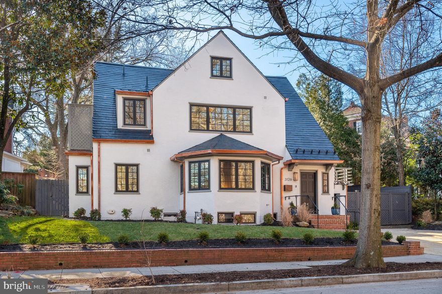 Open Saturday 1/21 & Sunday 1/22 1-3 pm! 3126 Woodley Rd NW is an impeccably renovated 1923 Tudor in the heart of Woodley Park’s historic community. Sited across the street from the beautiful woodland gardens and trails of Tregaron Conservancy and with easy access to Rock Creek Park, the Cathedral and Zoo, this luxurious property is close to some of DC’s most valued urban treasures. The re-imagined 5 Bedroom, 4.5 Bathroom, 4,600 SF Tudor boasts remarkable treasures of its own. Completely and masterfully renovated in 2022 by Dilan Homes, the residence showcases exquisite design and attention to detail at every turn of its open-concept floorplan. Natural light gleams through newly installed windows, highlighting the European wide plank white oak flooring, crown molding, and designer fixtures throughout the interiors. The Main Level’s Principal Rooms elegantly flow, creating a sublime, yet sophisticated ambiance as you enter the home. A sprawling Dining Area and Kitchen, boasting quartz countertops, Viking appliances, custom inset cabinetry, designer fixtures and walk-in pantry, offer direct access to the professionally landscaped, south-facing, rear garden and extensive patio complete with outdoor kitchen – a perfect pairing for al fresco dining and entertaining. 3 Bedrooms, 2 Full Bathrooms, and a Rooftop Deck with views of the expansive rear grounds make up the Second Level. The perfectly appointed Primary Suite features a walk-in closet with built-ins, spa-like bathroom with double shower, dual vanity, separate water closet and balcony access. The Top Level, with rare views of the National Cathedral, holds the fourth bedroom, a full bathroom with dual vanity, a Sitting Room with skylight and an abundance of storage space. Downstairs, the fully finished and multifunctional Lower Level features not only a spacious Recreation Room, but an Exercise Room, partial Kitchen, Laundry Room, additional storage space and fifth Bedroom with Full Bathroom. The recent renovation includes a replacement of all systems, windows, wiring and plumbing. An attached 1-Car Garage with storage space and 3 additional Surface Parking Spaces round out the numerous amenities this tremendous modern home has to offer. Woodley Park and adjacent Cleveland Park are desirable and coveted neighborhoods that are surrounded by parkland, offering their residents easy access to green space. The Smithsonian National Zoo, Rock Creek Park, National Cathedral, Woodland-Normanstone Terrace Park, and Tregaron Conservancy are within walking distance and have a number of sites, trails, and attractions to explore. Also within close proximity are five highly regarded private schools. The Woodley Park- Zoo/ Adams Morgan Metro station is less than 2 blocks away. The Connecticut Avenue and Wisconsin Avenue commercial corridors provide numerous restaurants and retail shops to its residents. From Woodley Park, traveling to other areas of the city including Georgetown, Dupont Circle, and Downtown is a short car ride or Metro ride away.