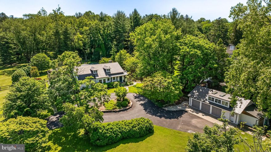 Historic charm blends well with modern updates and amenities. This classic 1908 Craftsman cottage is loaded with updates including the spacious kitchen with quartz counters, stainless steel appliances, and wide plank gleaming hardwood flooring.  All bathrooms have been remodeled. 2022 synthetic slate roofs on main house and guest cottage, 2022 zoned HVAC, and a whole house generator feeding the house & guest house. There are  replacement double hung Pella windows and original diamond patterned multi-light casement windows, an oversized living room fireplace and a bright sunroom with walls of windows and a flagstone floor, bonus rooms for office/extra bedroom spaces, a main level primary bedroom suite and laundry room.  The guest cottage, formerly used as an artist's studio, was totally restored and remodeled in 2023,  including kitchen, full bath, laundry washer & dryer, bedroom, and open living area with vaulted ceiling, clerestory windows, roof and skylights. The exterior  includes   a covered stone porch with adjacent flagstone patio with pergola, expansive play area with basketball court, ground level built-in trampoline, swing set and area for lacrosse playing.  All on a 2.7 private level lot. This is a charming cottage tucked away in the heart of Ruxton, a rare and exceptional home. The added 740 sq. ft. of the Guest Cottage offers many uses and can serve as a recreational area for children too.  SUNDAY OPEN HOUSE Sept. 21st 11 am -1:30  pm