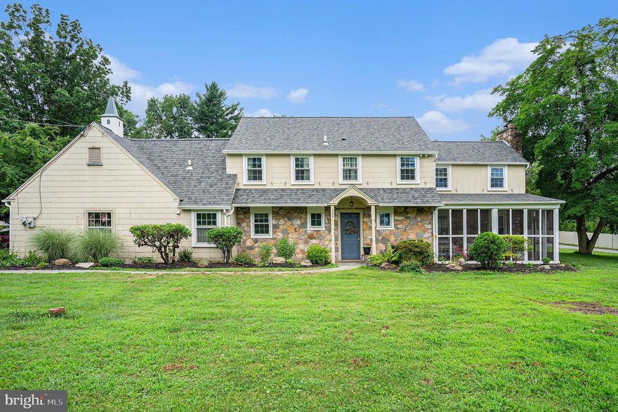 Welcome to 129 Township Line Road, a timeless stone Colonial bursting with charm, character, and functionality. Step inside to a spacious foyer that opens into a sunlit formal dining room featuring elegant crown molding, chair rail detailing, and built-in corner cabinets. The inviting living room offers a cozy fireplace framed by built-in shelves and a large bay window that fills the space with natural light. The bright white kitchen is both stylish and functional, featuring stainless steel appliances and easy access to the attached two-car garage. Across the foyer, you’ll find a dedicated office with built-in bookshelves and yet another picture-perfect bay window. Upstairs, the spacious primary suite includes a private bath, while three additional large bedrooms and a full hall bath provide room for everyone. One of the bedrooms offers direct access to the laundry area and attic. The full unfinished basement provides endless potential for additional living space, storage, or a dream workshop. Outdoors, enjoy your morning coffee in the serene screened-in front porch or unwind on the stone paver patio out back. Set on over half an acre of land, the property offers plenty of space for gardening, recreation, or simply enjoying the peaceful surroundings. Centrally located with easy access to major routes including Route 202, Route 422, I-76, and the PA Turnpike, this home offers seamless connectivity to King of Prussia, Plymouth Meeting, and Center City Philadelphia. Minutes from top shopping destinations like the Providence Town Center, King of Prussia Mall, and the charming Skippack Village, plus local favorites like Jeffersonville Golf Club, Norristown Farm Park, and a wide variety of dining options. Enjoy the best of suburban living with the convenience of city access—all from your own slice of Colonial elegance.