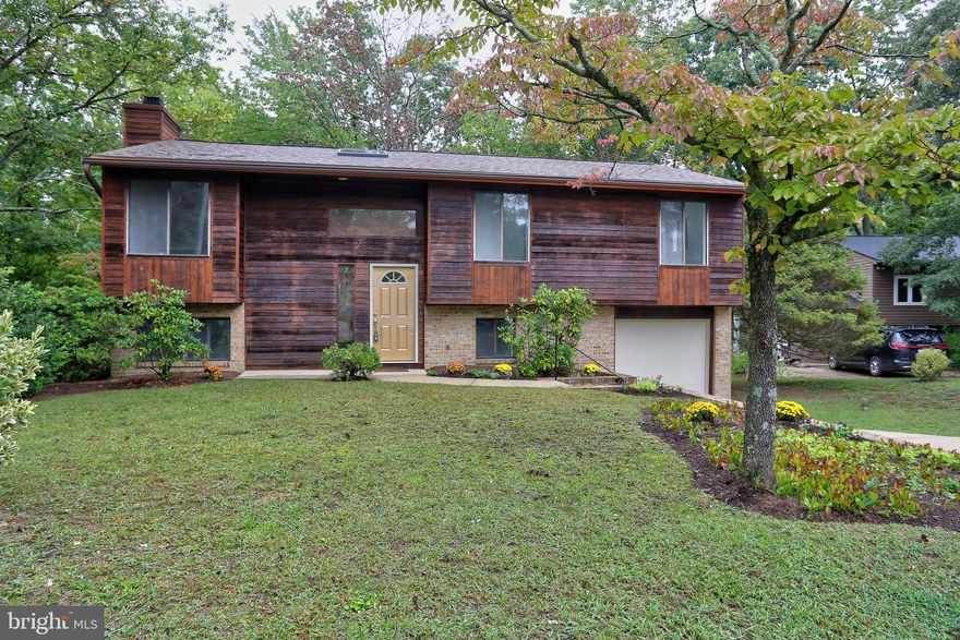 Back on the Market.....Come see this  Wonderful Home in Water Privileged Community of Lochwood in Sought after Severna Park . Move in ready with Freshened up paint, flooring and Neutral Carpet. 
Updates include new Roof with 30 year warranty. 2 New Skylights which  let in Light.     

Exterior Wood siding has been re- stained, Front Door is new ,New Mailbox,   Fresh Neutral Paint throughout the Home  is a blank canvas for you, Luxury Wall to Wall carpet is brand new and high quality,, stain and water resistant,
Stove only a few years old Meanwhile boasts ,three new Kitchen Appliances- Refrigerator,/ Ice maker  all new, Microwave and Dishwasher are new,   1/2 Bath in Lower Level has newly replaced vanity sink& toilet with light /Fan and Mirror, Laundry Chute, Laundry Room and  Utility Room has Washer and Dryer ( Dryer Vents cleaned out)and Storage Shelves,  Kitchen Sink and Faucet replaced  and included Garbage Disposal.  1 car Garage  in this quiet Court , Commute to BWI, Annapolis and Baltimore all in  
Wood Burning Fireplace in Family Room.  Home backs up to trees nature calls to the 2 level wood deck.