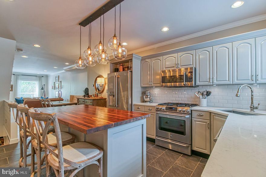 Gorgeous 3 BD & 2.5 BA townhome in arguably the best part of Canton.  Gleaming hardwood floors in the sun filled living room with exposed brick that flows to the dining room.  Kitchen renovation in 2017 features quartz counters, tile backsplash, stainless appliances, under-cabinet lighting and custom-built walnut island.  Half bath and mudroom on main level updated in 2016 with new tile floor, beadboard, custom shutters and custom built-in pantry.   The back patio isnt your traditional cinder block.  It features a newly designed patio with pavers, wood siding with bluestone cap and new custom door gate.   The second level includes a large primary bedroom with loads of light and brand new (2020) en suite bathroom with double marble vanity, large shower with glass door.  Second bedroom has a large custom built closet (easily removed to have a larger bedroom) and door to second floor deck with plenty of seating.  Second floor bath totally updated in 2018 with subway tile and all new fixtures.   Lower level redone with 2019 including new tile floor landing and custom built cedar closet, new carpet and window.  In addition to a large bedroom or living space, the lower level includes tons of storage in a water-proofed basement.  This amazing home offers the best of city living with close access to parks, restaurants, and all that Canton has to offer.