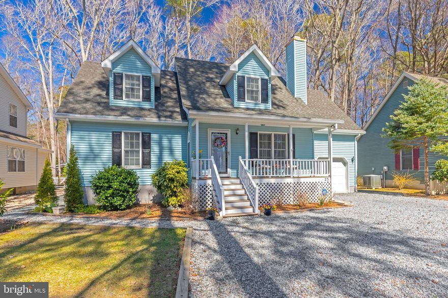 CLASSIC COASTAL CAPE COD style home located in the sought-after community of Ocean Pines.  Close to the resort town of Ocean City, natural beauty of Assateague National and State park beaches, charming downtown Berlin, and countless dining & entertainment options.  Look no further- you have found the perfect year round residence or vacation get-a-way in this  well-maintained home that offers both convenience and functionality.  Open floor plan great for entertaining. Hardwood Floors, Wood burning Fireplace (can be converted to gas).  Sunroom with Eze-Breezy Cascading Windows.  Large Open Deck overlooking a  brick paver patio and a large backyard garden with Hydrangeas and Hostas which add to the outdoor entertainment experience.  First Floor:  Large Kitchen w/oversized buffet counter, Dining Room, Living Room, Bed Room, updated bathroom, and laundry room.   Second Floor:  Two more Bedrooms, a  Bonus Room (Possible 4th BR) and an updated bathroom.  Garage, Shed and Multiple Attic Storage Areas.  New (2018) high efficiency furnace and new (2018)hot water heater.  Anderson Windows.  New (2024) professionally landscaped yard with: extensive tree removal, driveway garden ties replaced , brick borders, stone walkways, shrubs and plants. Oversized drive way can accommodate six cars.