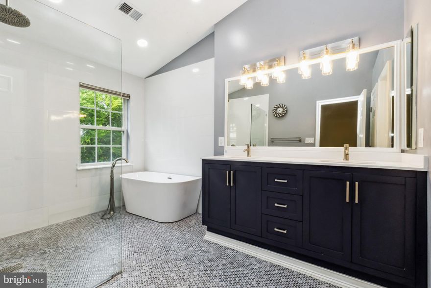 OPPORTUNITY KNOCKS---HOME BACK ON MARKET THROUGH NO FAULT OF SELLERS!!! Welcome to 49 Inkberry Circle in Hidden Creek.  This beautifully updated 3-bedroom, 3.5-bath townhome offers over 2,000 sq ft of elegant living space across three finished levels. This home features hardwood floors on the main level, an open-concept layout, and a sunlit gourmet kitchen with granite countertops, stainless steel appliances and ample cabinet space.  Upstairs, you'll find a spacious primary suite with vaulted ceilings, a walk-in closet, and a luxurious en-suite bath with soaking tub and separate shower. Two additional bedrooms share a well-appointed hall bath. The fully finished walk-out lower level includes a large rec room, full bath, laundry, and access to a private patio—perfect for relaxing or entertaining. Ample storage space that has a two car attached garage.  Additional highlights include a brand-new roof, newer appliances--washer, dryer and microwave.    Enjoy all the amenities Hidden Creek has to offer: pool, fitness center, clubhouse, trails, and more. Conveniently located near I-270, ICC, Metro, MARC, shopping, dining, and parks.