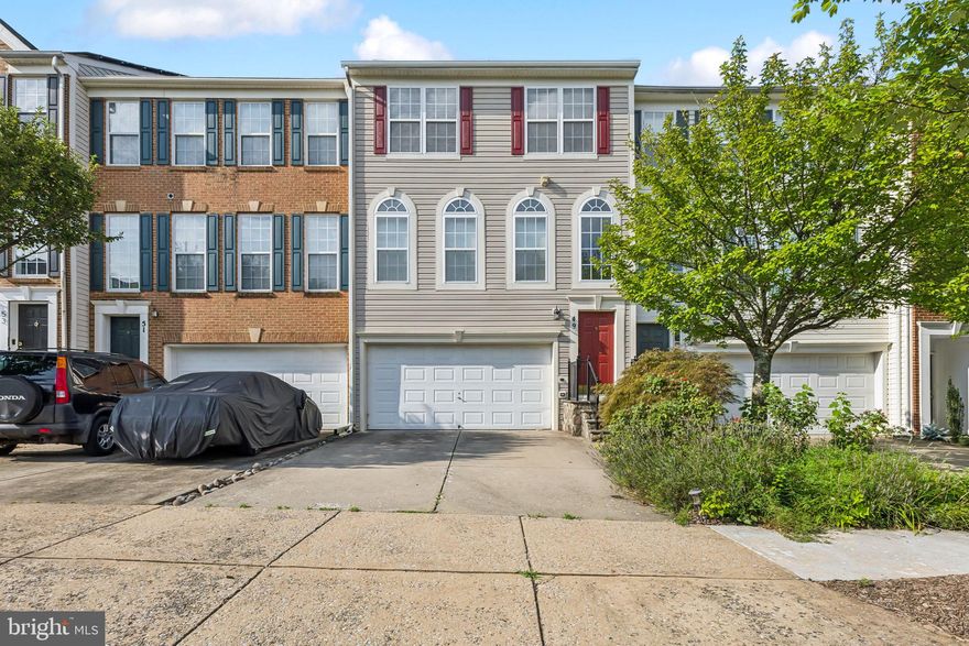 Welcome to 49 Inkberry Circle in Hidden Creek.  This beautifully updated 3-bedroom, 3.5-bath townhome offers over 2,000 sq ft of elegant living space across three finished levels. This home features hardwood floors on the main level, an open-concept layout, and a sunlit gourmet kitchen with granite countertops, stainless steel appliances and ample cabinet space.  Upstairs, you'll find a spacious primary suite with vaulted ceilings, a walk-in closet, and a luxurious en-suite bath with soaking tub and separate shower. Two additional bedrooms share a well-appointed hall bath. The fully finished walk-out lower level includes a large rec room, full bath, laundry, and access to a private patio—perfect for relaxing or entertaining. Ample storage space that has a two car attached garage.  Additional highlights include a brand-new roof, newer appliances--washer, dryer and microwave.    Enjoy all the amenities Hidden Creek has to offer: pool, fitness center, clubhouse, trails, and more. Conveniently located near I-270, ICC, Metro, MARC, shopping, dining, and parks.