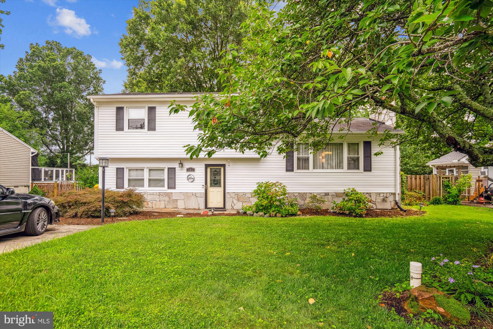 This Hillsmere Shores residence is conveniently located within walking distance of South River and Key School. The property features a flexible interior layout, including a main-level suite with a full bathroom and sitting area, currently utilized as a family room with a home office. A rear staircase offers secondary access to the updated kitchen, which showcases stainless steel appliances and granite countertops. Hardwood floors extend throughout the living and dining areas, as well as three bedrooms. The living room includes a fireplace with an electric insert, while the dining area—equipped with coffee bar cabinetry—opens to a climate-controlled four-season room. Upstairs, one bedroom has been converted into an office and another into a library; the third serves as the primary suite with direct access to the full bathroom. The fenced rear yard features a firepit area, patio, expansive green space, established gardens, and a potting shed. Situated within the desirable Hillsmere community, residents enjoy access to a beach, marina, boat ramp, and an optional community pool membership. The location is within walking distance to the library and Quiet Waters Park, and is convenient to shopping, restaurants, gas stations, Historic Annapolis, and the U.S. Naval Academy. "Special Financing Incentives available on this property from SIRVA Mortgage"