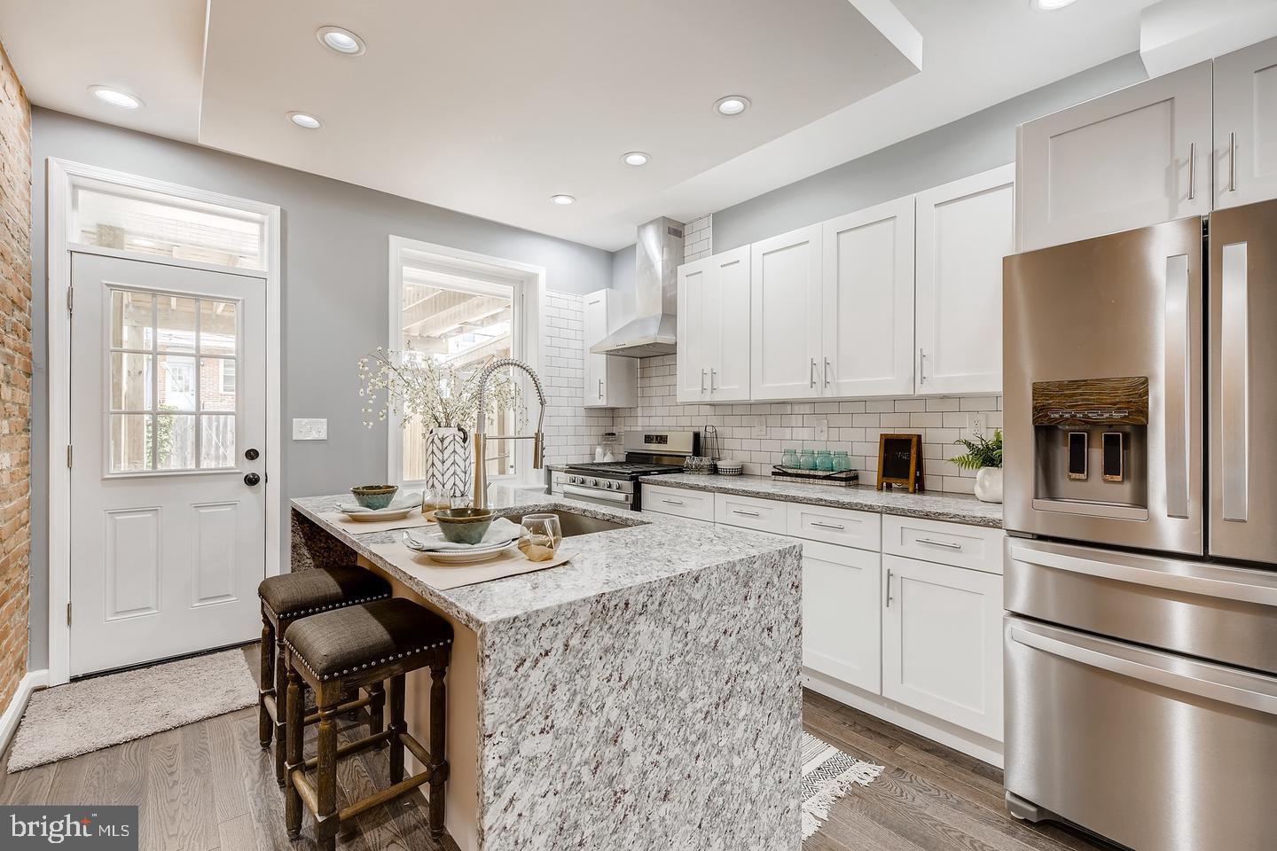 AMAZING NEWLY RENOVATED HOME! ROOF TOP DECK! PRIVATE PARKING! EASY STREET PARKING! FULLY FINISHED BASEMENT! THIS THREE BED THREE BATH HAS HARD WOOD FLOORS, FULLY RENOVATED KITCHEN WITH NEW APPLIANCES, GRANITE COUNTER TOPS! PROFESSIONALLY MANAGED! ONLINE PAYMENTS! SCHEDULE YOUR SHOWING TODAY!