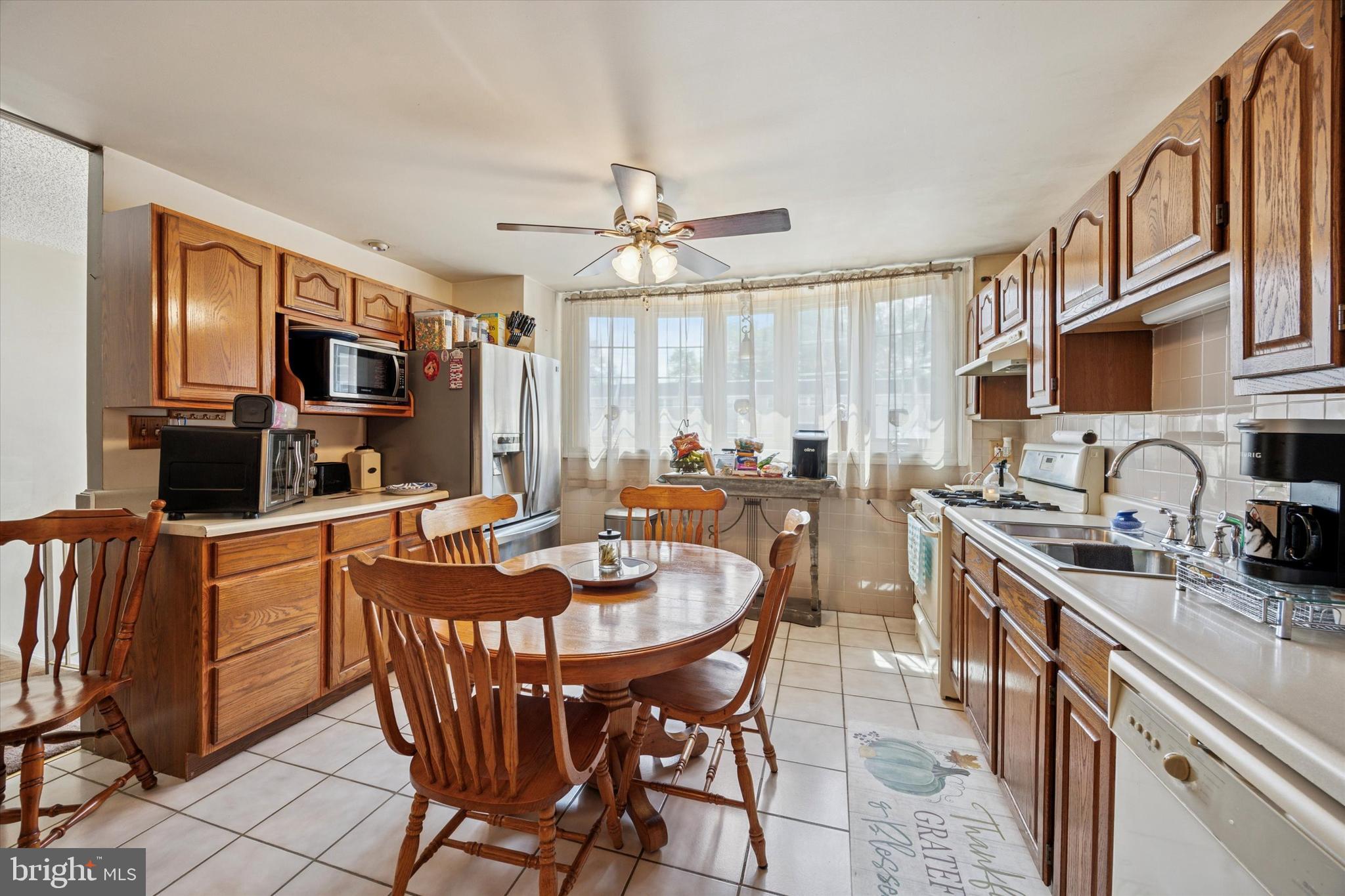Nestled in the friendly Millbrook neighborhood of Northeast Philadelphia, this tastefully updated townhouse offers a great mix of comfort and convenience. The main level features an open concept kitchen with wood cabinetry, gas range, dishwasher, refrigerator, and ceiling fan. It flows into a spacious formal dining area and an inviting living room. Step outside to a private backyard patio with a shed, perfect for relaxing or entertaining. Upstairs you'll find four spacious bedrooms. The primary bedroom has direct access to the full hallway bath, offering added privacy and flexibility. The lower level includes a finished basement with a half bath, a laundry area with washer and dryer, and interior access to a one car garage. Recent upgrades include a new HVAC system, forced air heating, and central air conditioning. With modern mechanicals, versatile living space, and a well established neighborhood setting, this home is an excellent choice for first time buyers, growing households, or investors. Schedule your showing today!