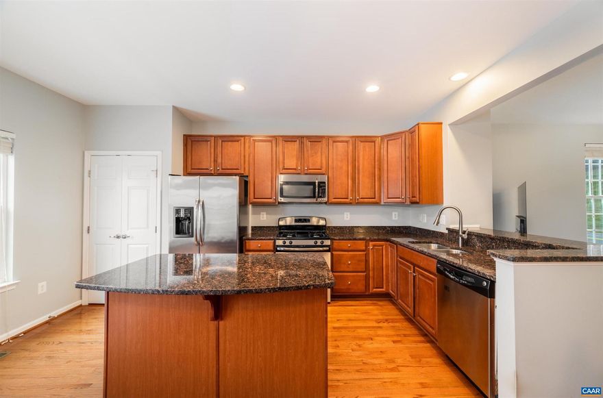 END UNIT, STUNNING KITCHEN, CONVENIENT LOCATION, AND MOUNTAIN VIEWS! Enter into this 3-bed, 2.5-bath, 1,611-fin sq ft light-filled, end unit townhome to experience a new HVAC unit, hardwood floors, a primary suite with Blue Ridge Mountain views, a stunning tray ceiling, an ample walk-in closet storage, and an attached 2-car garage! Grill out on the sunny back deck or prepare meals in the eat-in kitchen, featuring granite countertops, a dedicated pantry, center island, and stainless steel appliances. Utilize the basement as a work from home office space, rec room, or gym. Entertain with ease, knowing there are ample visitor parking options nearby as well as two parking spaces in the driveway, in addition to the two car garage. Enjoy the convenience of being located within walking distance to the neighborhood playground, just 3-5 minutes from Pantops shopping, convenience stores, Martha Jefferson Hospital, Darden Towe Park, and the Rivanna River, as well as only 5-10 minutes from UVA, The Downtown Mall, and 5th St Station (Wegmans, The Alamo, and more)!,Granite Counter,Wood Cabinets