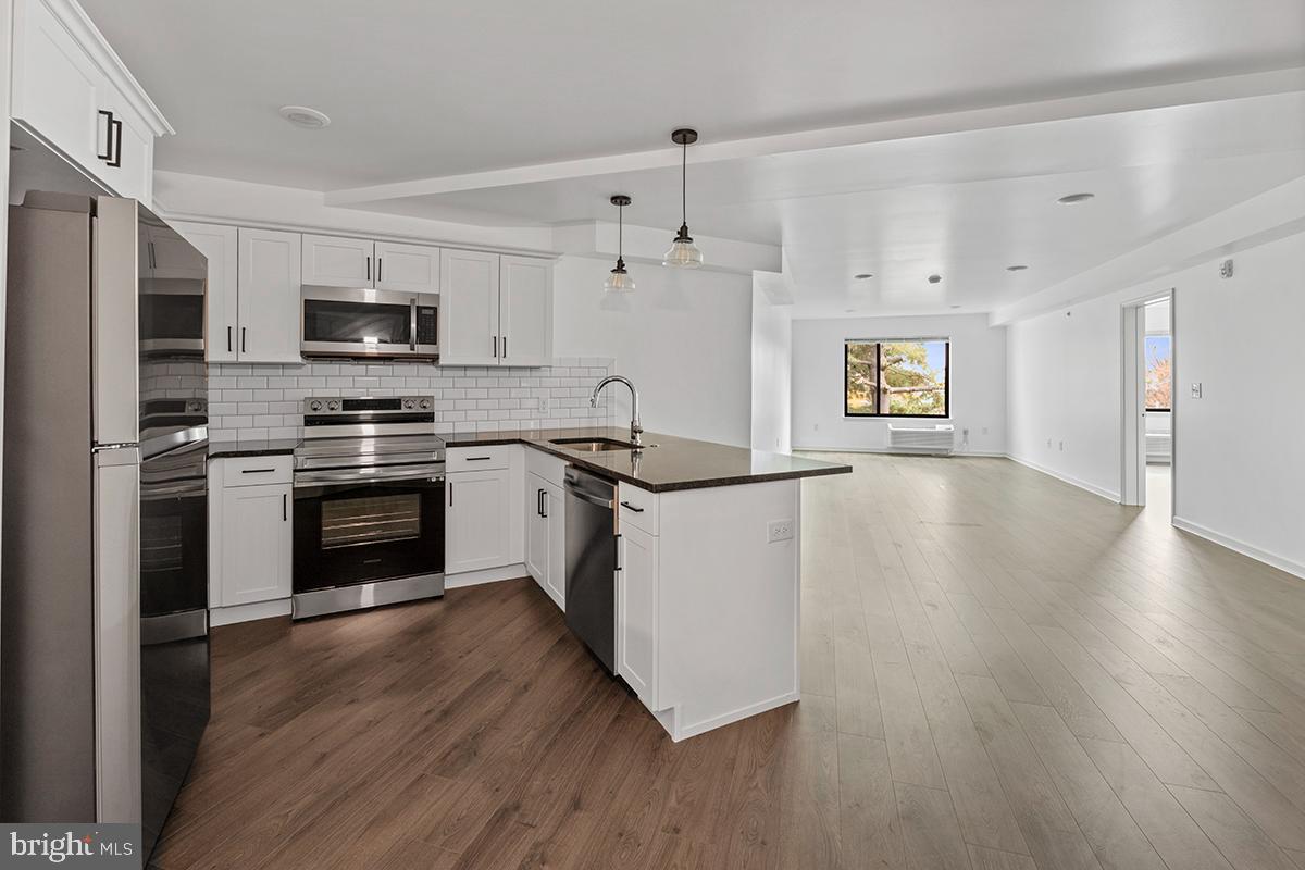 Get excited for July 1st because we've got the perfect spot for you at The Wright in Roxborough! This top-floor one-bedroom apartment is as spacious as it gets. Imagine cooking up a storm in the open kitchen with granite countertops and stainless steel appliances. And no need to worry about cleaning - the wood-inspired flooring is a breeze. Oh, and laundry day just got easier with your very own Washer/Dryer in-unit. Plus, with PTAC climate control, you can set the perfect temperature in every room. As if that wasn't enough, you'll have access to the green roof deck and a fitness center off-site - all included! And here's the best part: we're 100% pet-friendly with no extra fees. Don't miss out - apply now and make this your new home sweet home!