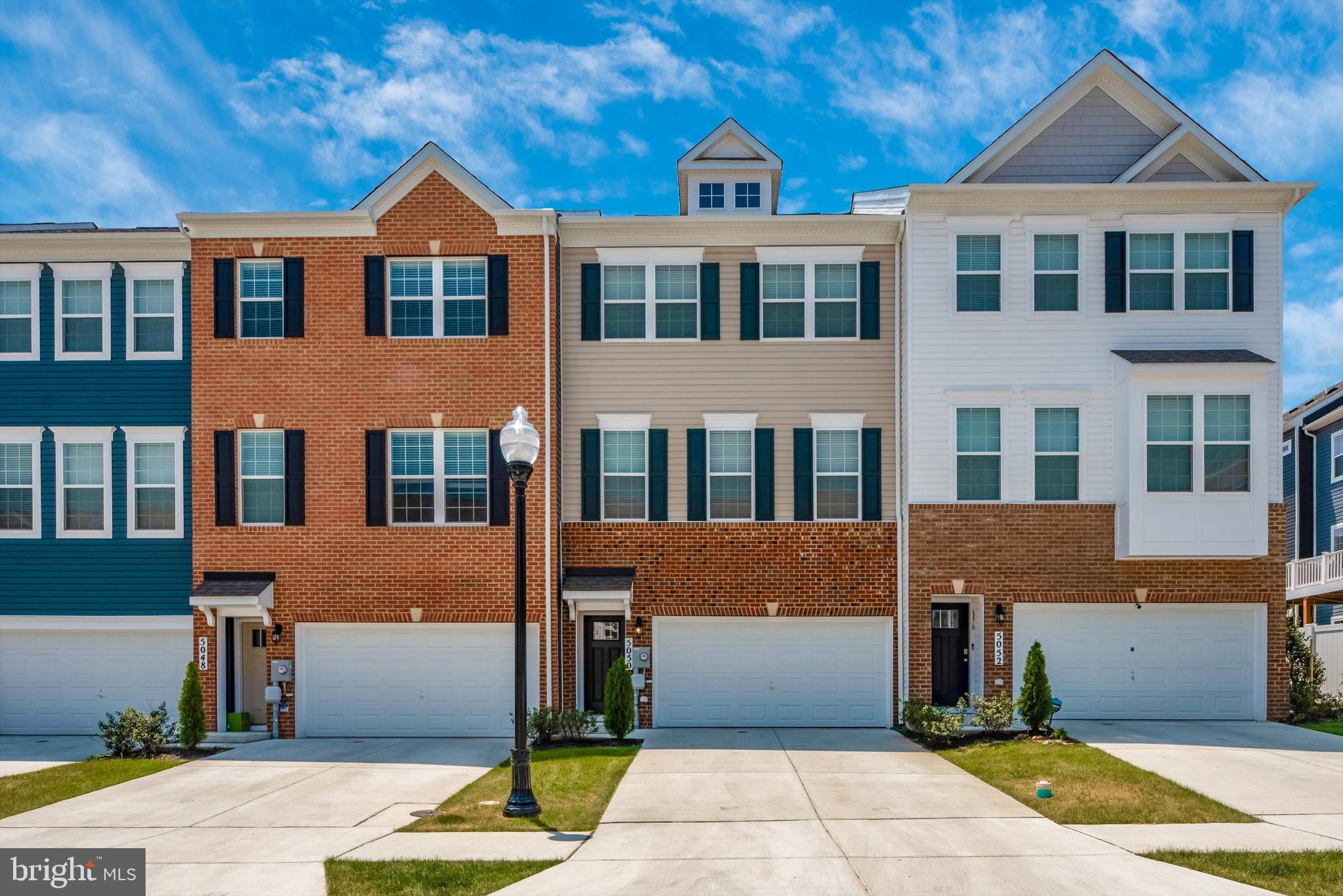 Beautiful 3 Bedroom Townhouse with 2-Car Garage in Prime Location. Welcome to this spacious 3-bedroom, 2.5-bath townhouse featuring a 2-car garage, a modern kitchen with quartz countertops, and stainless steel appliances. Enjoy the open layout and relax on the large deck—perfect for outdoor entertaining. Located within walking distance to Westview Promenade and just minutes from I-270 and downtown Frederick, this home offers both convenience and comfort. Community amenities include a swimming pool, clubhouse with fitness center, tot lots, and scenic walking trails. No pets, please. Move-in ready!