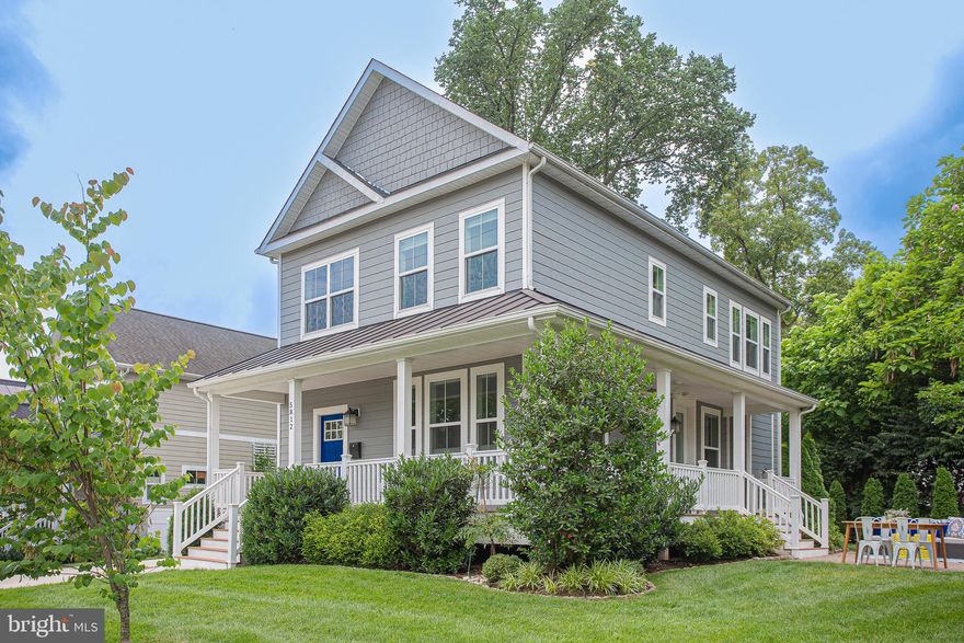 Welcome to a stunning and bright newer-build home in a charming historic district that's just a short walk to restaurants and shops, with an easy commute to DC as well as close to Metro.  This impeccably maintained home features clean, elegant, and modern amenities, all thoughtfully designed to complement the classic residential architecture in the Riverdale Park Historic District. The corner lot provides extra space, and mature landscaping frames the wraparound porch. The inside is equally impressive with Craftsman-style doors and detailing and natural hardwood floors.  An open and airy living space on the main floor is meticulously detailed with coffered ceilings and a gorgeous floor-to-ceiling stone fireplace surround.  Sharing the space is a gourmet kitchen with a Kitchenaid appliance suite and a huge quartz island. The main level also includes a full bath and additional living space easily converted into a main floor bedroom or office. Upstairs, the primary suite showcases a large walk-in closet and a spacious en suite bath.  There are two other bedrooms, a second bath, and a convenient laundry closet. The lower level is fully finished and complete with a large, open recreation room, two bedrooms, and a full bath.  At this home you’re close to everything including a Whole Foods, walking /biking trails, dining--and in a community with an 84 walk score and 77 bike score.  Note these extras: 9 feet ceilings and natural hardwood floors on both upper levels, 8-1/2 foot ceilings on lower level, extra insulation and double-paned windows with laminated glass for extra energy efficiency, in-ground irrigation, whole-house sprinkler system, and 240 volt for EV charging.  The outside appearance is often an indicator of what awaits inside....  There's no disappointment with this home.   It's as attractive inside as out!