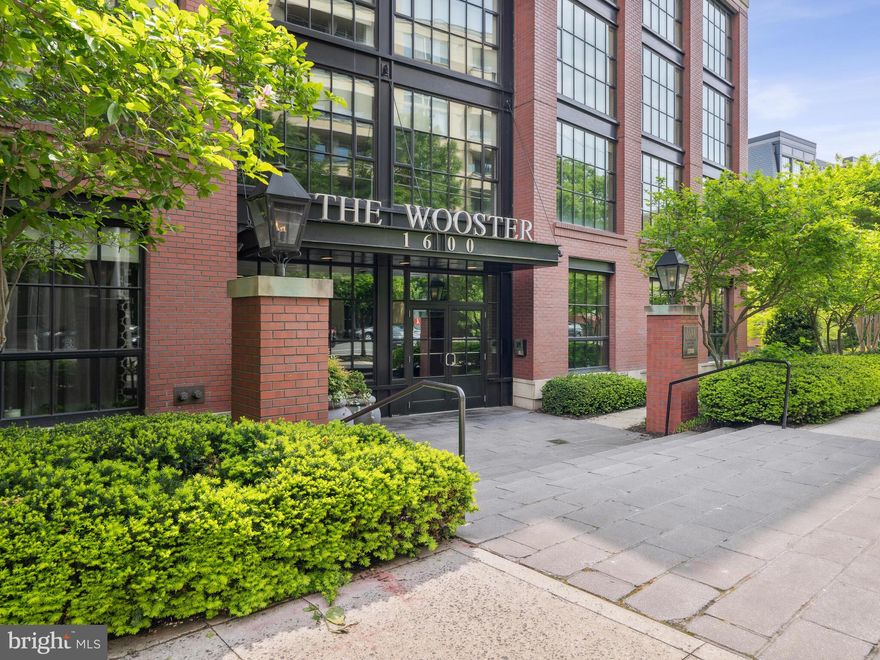 NEW PRICE. Same amazing opportunity. This condo is a WOW as soon as you walk through the door. Welcome to a stunning New York City style loft with 2 primary suites plus 2.5 baths at the sought after Wooster & Mercer. 1914 square feet of living space with jaw dropping and light filled floor to ceiling windows, 21 feet tall and stretching the width of the living area. The chef will enjoy an open gourmet kitchen with Sub Zero and Wolf appliances packaged with sleek stone countertops and excellent cabinet space. The kitchen overlooks the 2 story living room with delightful views and then a dining area bordered by the floating staircase. The main level features one suite with walk-in closet and spacious full bath. And the upper level has the 2nd suite with another walk-in closet and well appointed bath. Upstairs also boasts the loft area perfect for a family room or home office. There is corridor access to the unit on both levels, in unit laundry and the condo conveys with 2 assigned parking spaces.  Wooster & Mercer is pet friendly with concierge, pool, gym, and party room. Walk everywhere including to the Metro. A perfect 10!