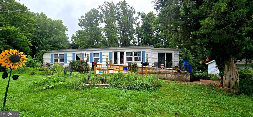 Great opportunity to homestead in Huntingtown for under $200K.  Think of the possibilities for this Beautiful site with over one acre of land....Chickens, gardens....endless possibilities.  Manufactured home on a basement with 4 bedrooms and 2 baths.  Third bathroom in lower level.  New well pump in 2018, New front windows, French doors, and front slider in 2019,  New septic in 2019.  No HOA.  A little TLC would make this an awesome place to escape from all the hustle and bustle but with an easy commute to the city.  Restaurants, movies, shopping centers, library, and community pool are located within minutes!  Property is livable as is.