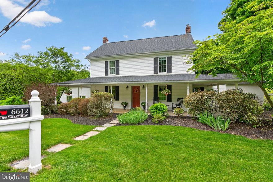 Step into a piece of history with this beautifully renovated home dating back generations.  Part of the original Schubert-Graber Farm. This home has been thoughtfully expanded over the years while preserving its timeless charm. This remarkable property offers approx. 3,300 sq. ft. of living space set on a breathtaking 2.3-acre manicured parcel extending into peaceful wooded areas with a creek for added enjoyment and privacy.  Offering 4 bedrooms, 2 full and 2 half baths.  A welcoming wraparound porch invites you inside to discover areas of stunning flooring, deep windowsills, French doors, and a cozy wood-burning fireplace in the living room. Spacious formal dining room is ideal for gatherings, while the beautifully designed kitchen features an island and breakfast area perfect for everyday living. Cozy radiant floor heating in Kitchen, Office & Laundry areas.   A main-level office provides an excellent work-from-home space. The impressive step-down family room showcases vaulted ceilings, beautiful built-ins, and a wood stove with a full brick hearth. Just beyond, the screened-in porch with wet bar and refrigerator offers great space overlooking the picturesque grounds. 1st floor laundry area leading to an enormous upper level rec room.  Two staircases. 2nd floor baths have been remodeled and bedrooms offer generous closet space.  Outdoor living is exceptional with paver patios, upper level deck, playhouse, large storage shed and garden area.  2-car attached garage, expandable attic space, lots of basement storage with walk-out access to the backyard, 3-zoned oil heat, second-floor central air, and main-level mini splits for heating and cooling. 12-month home warranty included. A truly one-of-a-kind historic property offering character, charm, modern comfort, and incredible entertaining spaces both inside and out.