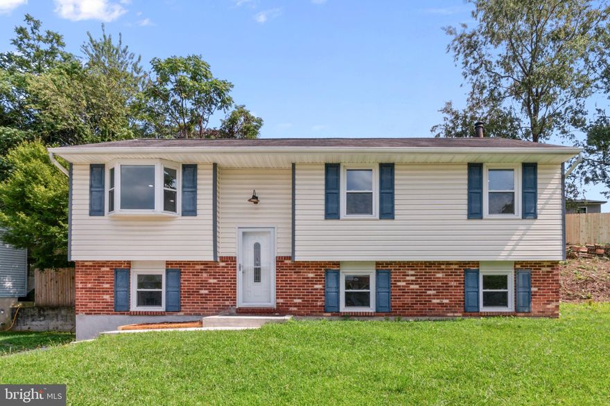 Recently renovated and beautifully updated split foyer home nestled in a quiet cul-de-sac, ready to welcome you with contemporary style and comfortable living spaces! The main level showcases luxurious vinyl plank flooring throughout, enhancing the spacious and light-filled family room and formal dining area—perfect for entertaining. The brand-new gourmet kitchen impresses with stainless steel appliances, sleek quartz countertops, stylish grey shaker cabinets, and ample cabinetry. Three generous bedrooms on this level include a relaxing primary bedroom featuring its own private, newly renovated half-bath ensuite. A fully updated hall bath with elegant ceramic tile surround completes the main level.

The lower level continues to impress with matching luxury vinyl plank flooring, offering even more versatile living space including a sizable recreation room, dedicated game room, and a conveniently placed fourth bedroom, ideal for guests or a home office. A brand-new full bathroom adds convenience to this level. Additional highlights include all fresh paint throughout, recessed lights throughout, and lower level walk-out. Outside, enjoy the spacious rear deck—perfect for outdoor entertaining or relaxation. This property provides both comfort and potential, making it a fantastic opportunity, being sold as-is!