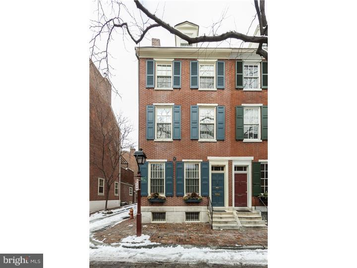 Stunning historic Society Hill home with private TWO car parking! This corner property is located on Delancey Street, one of the most sought out streets in Philadelphia. This home allows for the perfect opportunity to enjoy the convenience of city living without having to sacrifice the luxuries of a two car driveway. Open the front door and enter a truly elegant main level living area. The chandelier, high ceilings, grand staircase, and the original Pennsylvania blue marble fireplace (circa 1831) are just some of the features that make this home one of a kind. Continue towards the rear of the home and enter into a colonial style eat in kitchen with unique copper details, exposed beams and an exposed brick wall. The updated appliances including a double oven provide all the modern day cooking essentials within this traditional historic home. Next to the kitchen there is a powder room that was redesigned just weeks ago. The master bedroom is located on the second level and has a marble master bath with double sinks and a glass shower stall. Access to the deck is also through the master bedroom. The deck was recently renovated with IPE wood, a highly durable material that requires very low maintenance. The second and third bedrooms and another full bathroom are located on the third floor. The fourth bedroom spans the entire of the fourth floor. Additional: Within the last three years the brick exterior was completely re-pointed. Also, all new windows, a new roof, and a new heating unit were installed.
