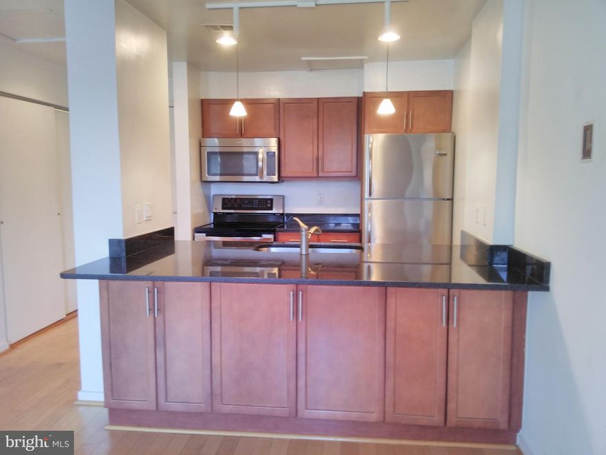 Canton's Waterfront lifestyle at the nostalgic "Shipyard" condominium.  Newly remodeled with granite counter tops, stainless appliances, wood floors throughout, wood cabinets.  Easy assigned parking in secure, gated lot.  Great 2br/2ba layout each with ensuite bath.  So convenient to Safeway, Starbucks, O'Donnell Square with shopping and restaurants close by.  Close proximity to Hopkins, Bayview. Excellent value!  Buy a 2BR for about the same price as a 1BR.