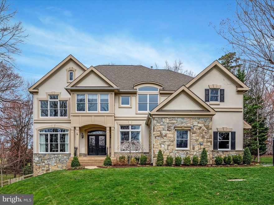 One of a kind, custom-built single-family home, epitomizes luxury living without sacrificing character. Transitional styling with beautiful stone and stucco facade, and prominently perched on a generous .65-acre lot, this residence boasts impeccable craftsmanship and distinctive features that set it apart from the rest. Peaceful and private, yet ideally located within minutes of shopping, dining and Oakton/Fairfax/Reston amenities.
A long driveway flanked by a lush lawn and mature wooded lot greets you with open arms. 
Step inside and be impressed by an inviting atmosphere, highlighted by fine hardwood floors and 10-foot ceilings. A creative  floor plan boasts custom molding running throughout with great attention to quality and detail. Grand entryway features dramatic two-sided fireplace, setting the tone for warmth and sophistication, while natural light pours in through the architectural transom windows.
Newer HVAC systems and water heater will provide the new owners many years of comfort. Entertain with ease in the spacious living areas, including a formal dining room overlooking the fairway-like front yard.  The gourmet kitchen is chef quality, complete with high-end appliances, granite countertops and center island. Enjoy casual meals in the eat in breakfast area and relax in the cozy family room adjacent to the kitchen.  The custom screened-in porch is a wonderful addition for al fresco dining and enjoying wooded views. Main level also features a convenient home office for remote work or study. Upstairs, you’ll find four generously sized bedrooms, including an expansive primary suite with tray ceiling,sitting area, ensuite bath and dual walk-in closets. A bonus fifth room with cork flooring offers versatility as a gym, playroom, or additional living space. 
The finished lower level of this beautiful home provides plenty of space for the entire family.  A fifth bedroom with full bathroom, is ideal for guests or in-law suite. The large recreation area offers flexibility to make your own and rear yard access via walk out. Huge amount of storage space features custom built-in shelving and room for future expansion.  
All of this with an A+ location, a highly desirable neighborhood and zoned to top-rated Oakton school pyramid. Major routes, Fair Oaks Hospital, International CC nearby. Walk to Navy Elementary.  Don't miss the perfect place to call home!