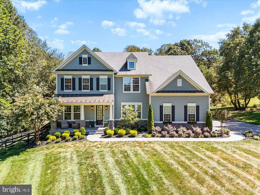 Welcome to 3607 Moline Court—a thoughtfully designed, one-of-a-kind estate nestled on over 11 private acres in the heart of Monrovia. This stunning 5-bedroom, 4.5-bathroom home offers more than 5,000 finished square feet of luxurious indoor and outdoor living space, creating the ultimate private retreat.
Step inside to find rich hardwood floors flowing throughout an open-concept main level. The spacious living area features a cozy fireplace and opens seamlessly to the upper-level outdoor patio, complete with a beautiful stone fireplace and sweeping views of the wooded landscape.
The gourmet kitchen is a chef’s dream—boasting a massive center island, granite countertops, stainless steel appliances, a gas cooktop, double wall ovens, a butler’s pantry, and a walk-in pantry with floor-to-ceiling storage. A separate formal dining room provides an elegant space for hosting and entertaining.
Also on the main level, you’ll find a dedicated office with built-in cabinetry and a versatile bonus room—ideal for a playroom, craft room, or additional workspace—featuring floor-to-ceiling built-ins for extra storage.
Upstairs, the spacious primary suite offers a peaceful sanctuary with a spa-like ensuite bath and dual walk-in closets. Two additional bedrooms are connected by a Jack-and-Jill bathroom, while a fourth bedroom enjoys its own private ensuite. A full laundry room and convenient coffee bar complete the upper level.
The finished walk-out lower level adds even more living space, including a large family room, full bath, fifth bedroom, and ample storage.
Step outside to enjoy an entertainer’s paradise—featuring an expansive backyard with an outdoor bar, built-in grill, mini fridge, fire pit, and plenty of space for gatherings. Whether you’re hosting friends or simply relaxing, this space is designed for unforgettable moments.
Explore your very own private trails, stream, and acres of woods—perfect for hiking, bowhunting, or ATV adventures.
3607 Moline Court offers the rare combination of luxury, privacy, functionality, and natural beauty. Don’t miss the opportunity to make this extraordinary estate your forever home.