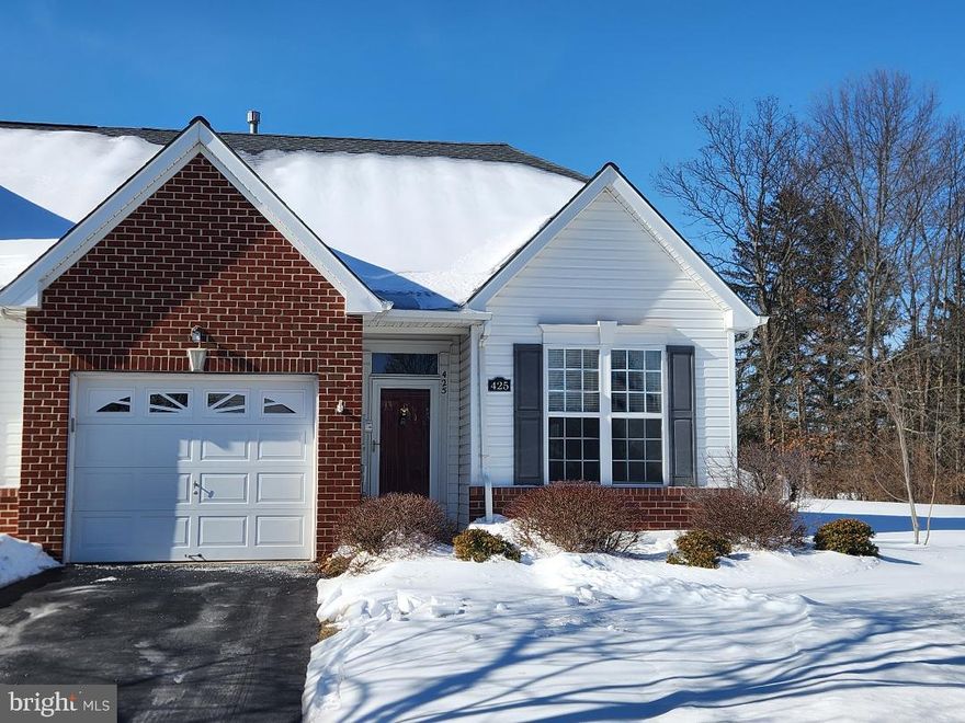 Lovely Brick Front End Unit Townhome in the over-55 community of Salford Mill.  Hardwood Foyer welcomes you into this light-filled home.  Eat-In Kitchen has an abundance of cabinets and countertop space.  Dining Area is adjacent to the Family Room highlighted by a Fireplace with Mantle and Marble surround.  Step out onto the Covered Patio to enjoy the privacy of Wooded Views.  Primary Bedroom features a Walk-In Closet, bonus Closet, Ceiling Fan and an En-Suite Bathroom with Linen Closet.  The Powder Room combines the convenience of a main floor Laundry area.  Upstairs to the expansive Second Bedroom boasting a Full Bathroom, Large Closet, Ceiling Fan and Storage Room.  One Car Garage, Two Car Driveway Parking and ample overflow parking for guests.  Peace of mind comes from recent updates of the Roof (2022), HVAC (2022) and Water Heater (2025).  Convenient to major routes, shopping and dining.  Welcome Home!