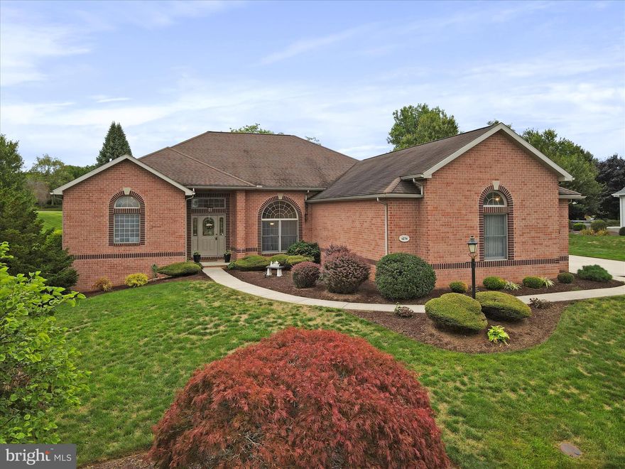 Prestigious all brick home in the Penn National golf course community!  Built by local builder Bryan Hey, this one owner home features include: a spacious primary suite with sitting area, trey ceiling, his/hers walk in closets, double sided fireplace, jetted tub in the bathroom, cathedral ceilings in the great room and 11' ceilings elsewhere, engineered hardwood throughout the living area, gourmet kitchen with granite, breakfast bar, informal dining area, and custom oak cabinetry.  The following were replaced in '23: Double oven, refrigerator, water heater, and duel fuel furnace.  Covered patio on the back for outdoor entertainment.   Large basement has a finished office/exercise room and is a walk up on the side.   Side entry, 2 car garage.  Available immediately!