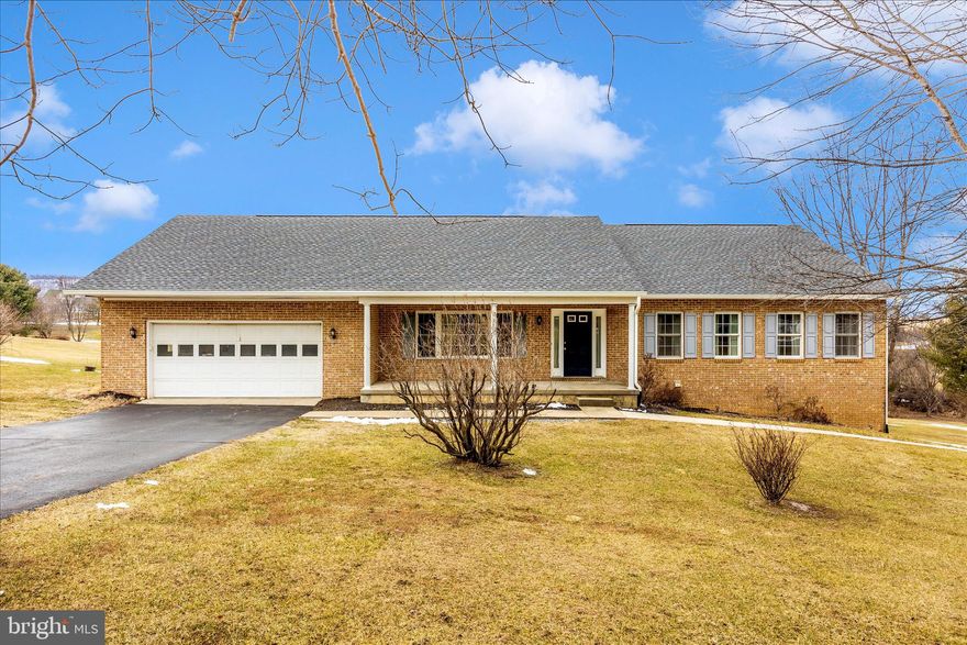 Discover the perfect blend of comfort and convenience in this spacious all-brick rancher — proudly offering no HOA and no city taxes! Designed for flexibility and accessibility, this home features wide doorways and hallways, making it ideal for anyone needing easy mobility.  Enjoy two full levels of living space, each with its own kitchen and laundry facilities — perfect for multi-generational living, guests, or rental potential. The main level opens to a large deck, partially covered for year-round entertaining, overlooking beautiful scenic views.  Recent upgrades include a brand new roof, gutters, and downspouts, giving you peace of mind for years to come. Inside, you’ll find spacious rooms bathed in natural light, ready for your personal touch.  Conveniently located near major commuter routes, grocery stores, dining, and gas stations — everything you need is just minutes away.  Homes like this don’t come along often — schedule your showing today before it's gone!