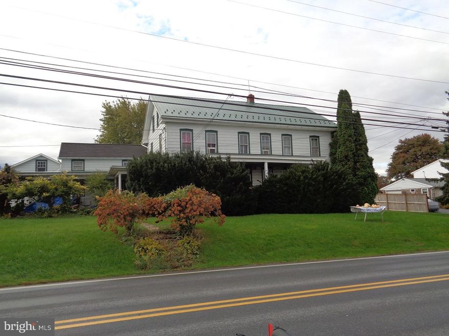Level, high producing farmland. All tillable. Large barn for feeding cattle, silo. Currently barn and land, house rented. 3 unit farmhouse fully rented.