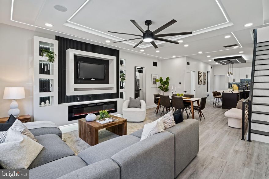 Modern. Spacious. Impressive. This 18-foot wide home will challenge your assumptions about living in the city. Enter to an enormous main level, staged with a suburban-style sectional couch and enhanced by linear recessed lighting. The built-in, tiered shelving is the perfect place to highlight art or entertainment system. The living area flows seamlessly through dining space and into an open kitchen. Bright and modern selections, elegant ceramic backsplash tile, upgraded stainless appliances, and a pot-filler faucet over the range/oven. Beyond the kitchen, an east-facing sunroom makes the perfect den, home office, or study which could easily be converted to a main level bedroom. Oversized glass doors open to an enormous rear yard with pergola. Bathroom on the main level for convenience.

Of course, another great thing about a wide house is big bedrooms. Upstairs you’ll find three, well-apportioned bedrooms with ample closets for storage. Spa-like bathroom with soaking tub, walk-in shower, and floating vanity. Linear lighting in hallway and primary bedroom.

Full, unfinished basement for storage with ample ceiling height. Convenient to Center City Philadelphia, I-76, and Fairmount Park. Schedule your private showing today!