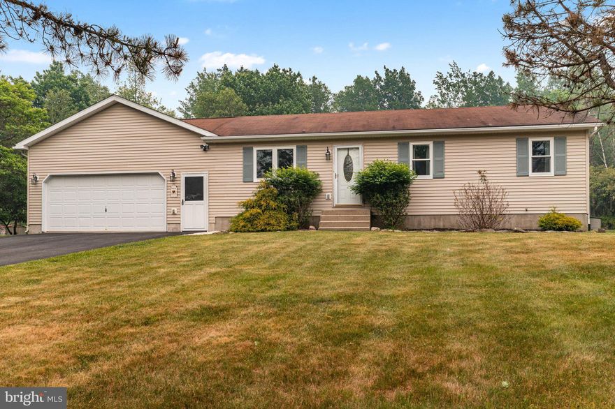 MUSIC ENTHUSIASTS WON'T WANT TO MISS THIS! Welcome to 205 Ryan Rd. This home has the perfect blend of a cozy Pocono home & a space like no other to CREATE MUSIC & JAM OUT! Featured on the main level is a spacious Primary BR & On-Suite Bath, added in 2006. A bright, open KIT w/ Stainless Steel appliances looks into the naturally lit LR. Down the hall you will find a tastefully updated 2nd Full Bath, along w/ 2 more roomy BRs w/ ample closet storage. The lower level is the REAL TREAT! Fully equipped w/ well-constructed sound booths & a space for mixing, this basement space is any MUSIC CREATOR'S DREAM! Love music, but it's not your passion? That's ok. The sound booth walls are not load-bearing, and can be removed to create a space of your own vision. It could make for a great theater room, too. A lovely backyard space to enjoy the quietness of the mountains or an occasional Pocono Raceway Airshow, & an oversized 2-car garage complete this house. Anyone would be lucky to call this HOME!
