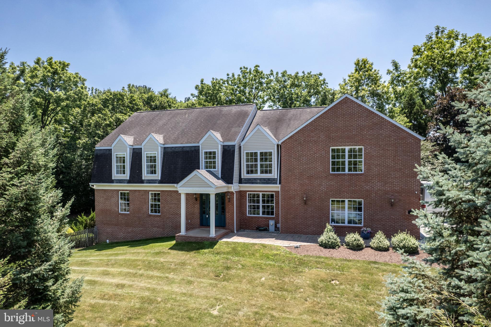 Welcome to 1320 Topkapi Dr, a stunning 4-bedroom, 2.5-bath custom colonial nestled on a beautifully landscaped and private 1.64-acre lot in Westminster, MD. This exceptional home boasts a brand new kitchen (2024) featuring quartz countertops, a huge island, dining area, all new stainless steel appliances, and flows seamlessly into the formal dining and living rooms—perfect for entertaining. The main level also offers a first-floor office and a cozy family room with a vaulted wood ceiling, stone floor, and a gas fireplace, creating a warm and inviting atmosphere. Enjoy all new hardwood flooring on the main level and throughout the upstairs primary suite and hallway. The expansive primary suite is a true retreat with a sitting area and three walk-in closets with custom built-ins, soaking tub, walk in shower and two sinks. Additional highlights include custom built-ins and elegant light fixtures throughout, upstairs laundry for added convenience, and a 3-car side load garage with vinyl flooring. The unfinished walkout basement provides endless possibilities for future expansion. Step outside to your own private oasis with an outdoor kitchen featuring a grill, refrigerator, and granite countertop, a stone patio with retractable awning, a grand pavilion, and a sparkling pool—all surrounded by extensive gardens and landscaping. Major updates include dual zone HVAC with a new heat pump (2024) and oil backup, a newer boiler (2019), a new water heater (2025), and a 50-year roof for peace of mind. This meticulously maintained home offers luxury, comfort, and privacy—truly a rare find!