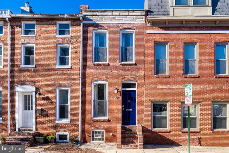 Enjoy fantastic views from the roof top deck of this updated 2 bedroom, 2 bathroom Federal Hill beauty. The main floor boasts gleaming hard wood flooring, built-ins, tall ceilings, exposed brick, and tons of natural light. The combined living & dining room is spacious and open great for accommodating & entertaining guests. In the kitchen you will find a large island/ breakfast bar, updated counter tops (granite) & appliances, ample cabinet space, and access to the private patio a fantastic spot for your morning coffee.  The upper level provides 2 bedrooms both with en suite bath rooms, a hall brightened by sky light, and access to the roof top deck w/ some of the best views in town.  Mins to 695, 95, stadiums, shopping, restaurants & parks.  Welcome to 1502 William St!!!