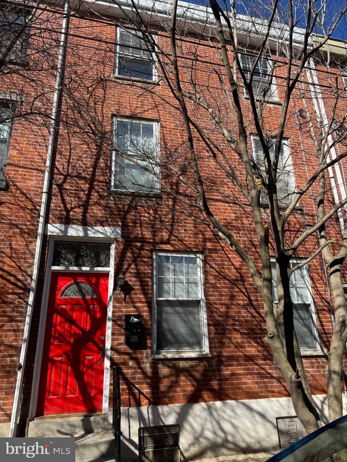 Welcome to 930 N Randolph St—an updated and spacious 4-bedroom, 2.5-bath townhome located on a quiet, tree-lined block in the heart of Northern Liberties. This classic brick-front home offers a perfect blend of historic charm and modern convenience. Step inside to find hardwood floors, exposed brick accents, and generous natural light throughout. The main level features an open living/dining area and a powder room, ideal for entertaining. The kitchen is equipped with stainless steel appliances and leads to a large private backyard—perfect for outdoor gatherings. Upstairs, you'll find four spacious bedrooms, including a top-floor primary suite and two full bathrooms. Central A/C and forced-air heat provide year-round comfort. The finished basement includes laundry hookups and additional storage. Enjoy being steps from the Piazza, El train, local cafés, restaurants, and more. This is a rare opportunity to own a move-in ready home in one of Philadelphia’s most vibrant neighborhoods! Schedule your showing today!
