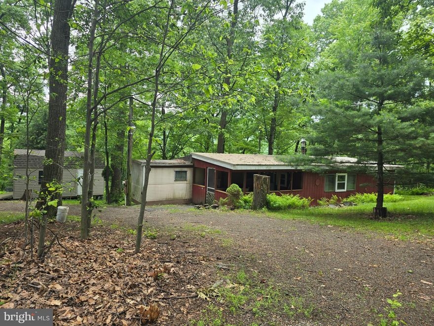 Looking for a quiet place from the hustle and bustle ?  Take a look at this 3 + acres.  Seller has owned and used the property seasonally for 30 years; it includes a furnished , 3 bedroom, 1 bath 1970 mobile home with addition, well and septic. Oil furnace and wood stove heat.  Being sold  " as is"  No known issues. Roof on mobile is approximately one year old. Detached garage and another outbuilding included.  Property is accessed but a deeded R.O.W.