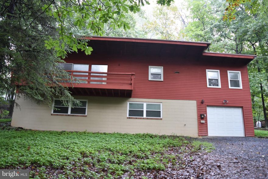 Gated Community  Contemporary Home on 1.5 Acres, Paved Road, Community Pool, Tennis, Tot Lot . Exposed Beams, 2 Fireplaces, Deck.  Minutes to I66.  Sanitary District, Community Water  Basement has MOLD!  Sold AS IS