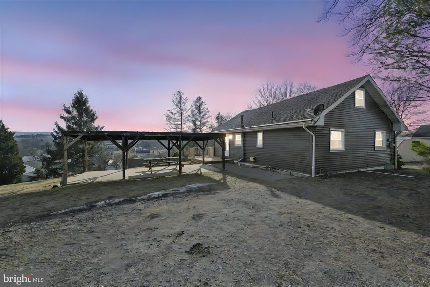 Welcome to your mountain retreat! This charming chalet-style home on 0.6 acre offers the perfect blend of cozy living and breathtaking natural beauty, all at a reasonable price point. Step inside to discover an inviting open floor plan that maximizes every square foot while highlighting stunning mountainside views through replacement windows. The main level features two comfortable bedrooms and a beautifully updated bathroom with a newer walk-in shower. Upstairs, a versatile loft space awaits your imagination—transform it into a home office, creative studio, or perhaps a third sleeping area for overnight guests. Picture summer evenings gathered under the pavilion at your picnic table, surrounded by the peaceful sounds of nature and tranquil views. A detached one-car garage—sporting a roof replaced in 2020—keeps your vehicle and toys protected from the elements. A quaint, framed entryway with gorgeous stone mailbox invites its new owner home. Practical touches abound throughout this well-maintained property, including vinyl siding over log construction, a lifetime basement waterproofing system, and an unfinished basement offering ample storage potential. For those with vision, renovation opportunities exist to customize this gem to your exact specifications. Located nearby the east gate via Running Deer Drive, you'll enjoy easy access to nearby F Dock for lakeside adventures and recreation. Whether you're seeking a weekend getaway, permanent residence, or investment opportunity with upside potential, this chalet checks every box. Schedule your private tour of this must-see, quintessential mountain retreat. 

Lake Wynonah is a gated community featuring 2 gorgeous, freshwater lakes. Lake Wynonah is approximately 90 ft. deep and Fawn Lake 45 ft. deep at deepest areas. Amenities include: business office/gathering room/library, lodge w/dining and bar, social clubs, boating, fishing, wakeboarding, waterskiing, tubing, paddleboarding, tennis, pickleball, several parks/pavilion, basketball courts, horseshoe pits, pool, beautiful docks, hiking trail, natural wildlife and marina. Active Civic Association, Fish & Boat Group. Located approximately an hour from Allentown, Harrisburg, Hershey and Reading. Close to Philadelphia and surrounding suburbs. Beat the beach traffic and settle in at the lake. Lake Wynonah is "Life On Vacation"!