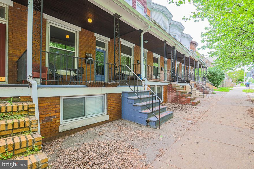 CHARMING 3 Bedroom 2 FULL Bath BRICK Front Townhome in Hampden Historic District * Features Include:  Living room with built ins * SPACIOUS dining room * 9 foot ceilings * Hardwood floors * Ceiling fans * COZY kitchen with an island, stainless steel appliances and TIN backsplash * On the UPPER level you will find a light and airy PRIMARY bedroom, second bedroom, den and a FULL bath * The LOWER level offers a SPACIOUS family room, bedroom, FULL bath and utility area * Fenced yard * Walkable to Hampden shopping and restaurants * Close to downtown and major arteries!!