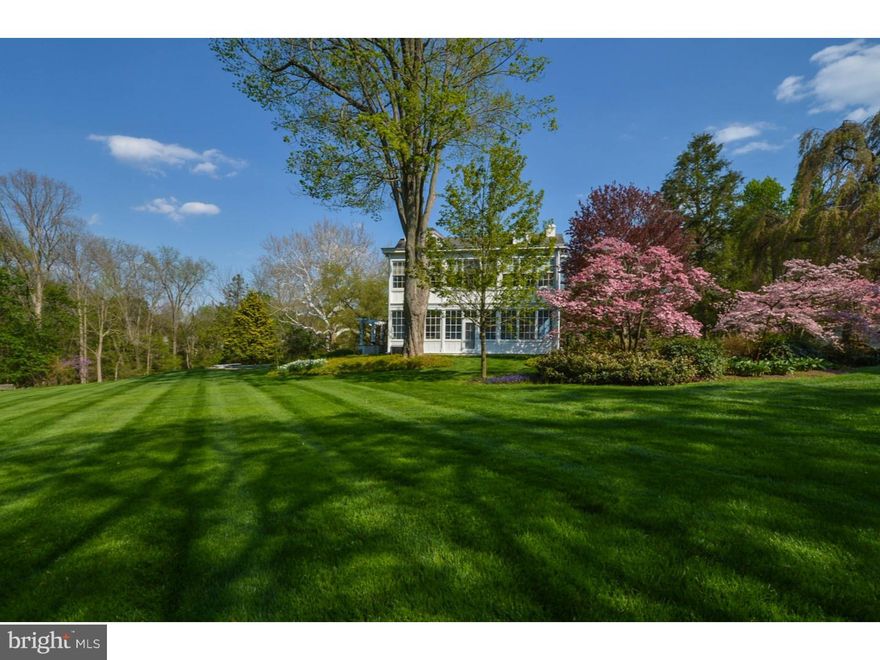 This pristine and very private two and a half acre estate nestled on a short dead-end road in the Wissahickon Creek valley combines the best of history with sophisticated contemporary design. Exquisite grounds with sweeping views of lawn, mature specimen trees and landscape features, surround the compound of stately house and carriage house.  The house represents the highest level of traditionally detailed improvements, and is updated with striking modern design. Expertly crafted mill work and Architectural Digest level character can be found everywhere: in the wood countered pantry wet bar, the bespoke kitchen, and glass exterior railings among many standout aesthetic treats. The Joanne Hudson designed kitchen is a fully functioning chef's working kitchen and also an elegant social center for any dinner party. Downsview cabinets, granite and stainless steel counters and a unique Cheng designed brushed steel range vent are but a few of the many features in this elegant and generous kitchen; there are two large sinks and dishwashers. This whole area including the connecting intimate family sitting room and cantilevered "martini" deck and large patio deck  is a jewel of a space designed by the architectural firm Lynch Martinez. The wrap around glass just beyond the gas lit wood fireplace (one of three in the home), affords a high ground and sweeping view of the gently sloping landscape. This family home was originally a classic 3-story two fireplace early 18th century Pennsylvania farmhouse.  It was upgraded primarily in two successive additions: at the turn of the 20th century and again in the 21st century. The first floor includes formal and elegant historical spaces for living, dining, study and relaxing; there is even an original 2 story glass enclosed porch. The second floor master suite includes a bedroom, walk-in closets, full marble bath and adjacent generous sized study (or bedroom). Two additional bedrooms and two baths complete the second floor. The third floor has three additional bedrooms and bath. Closets are generous throughout. The main deck has a large spa integrated into it and overlooks the heated pool with its power swim jets and waterfall. A stone outside shower is in the pavilion area. Separately deeded 2 acres are available.