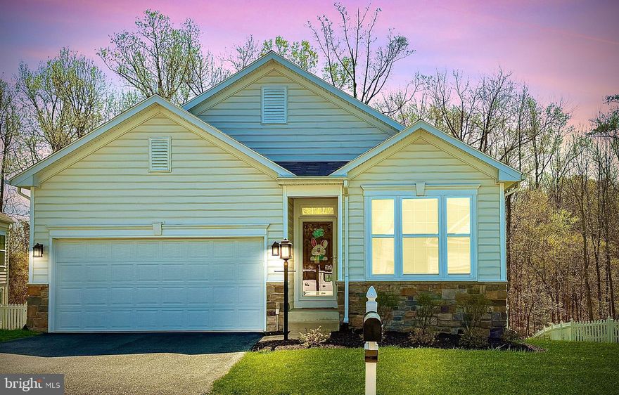 Popular Leeland Station 55+ section  within the Leeland Station Subdivision.  This Lovely one level home with basement boasts open concept living with hard wood floors through out. HOA maintains the yard, including mulching, lawn care and snow removal . This home has been meticulously taken care of by the current owners. New Roof in November 2023, the Primary Bedroom suite is separated from  the other rooms with plenty of space with adjoining full bathroom and walk in new custom closet  by Closets by Design.  
Custom Maple Cabinets feature Double wall ovens  and for the one who loves cooking, a gas cooktop. Nice large kitchen island is perfect  for hosting events and just hanging out to have coffee!  Guest bedroom on main floor with a full bath, double french doors present a beautiful office or possible library or even a gym!  
Wait until you see the spacious basement with a workshop, gym or even room for both!  So much Storage Space!!  The secondary living  room space provides so many possibilities. Plenty of options with all the space you have!  Basement features a walk out onto a stoned patio to relax.  
***Saving one of the best parts for last is the amazing seasonal room on the first floor off of the Living area. This room boasts vaulted wood ceilings, a stone floor,  a floor to ceiling gas fireplace with mantle,  and right  out the door is Trex decking for grilling and relaxing in the peaceful sun.  Back deck overlooks the trees which hosts a walking path beyond.  Stairs accessible to lower level patio or backyard!  Beautiful Home!!  Less than a mile distance to the VRE! Close to downtown Historic Fredericksburg.