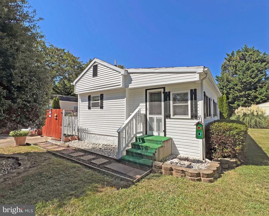 Motivated Seller ! New Price !This singlewide home has three additions; a 10’x16’ addition off of the living room, a 12’x12’ bedroom addition, and a 12’x24 main bedroom suite addition; for a total of 1,288 sq. ft. of living space!  Nice outdoor living space, too, in the fenced, side yard. Compact kitchen includes a fridge, cooktop, range hood & a wall oven. The laundry area is next to the kitchen; that’s where you will find the countertop microwave. The addition off of the living room could be a family room or a dining room. All of the bedrooms are at the rear of the house. The first small bedroom is next to the first full bath, which has a tub/shower. The second bedroom has vaulted ceilings and its own door to the backyard. The main bedroom is at the rear of the home and it is en Suite. That bath has a stall shower.  Central AC. Oil forced air heat. Metered gas for cooking. Outdoor shower. Storage shed. Leasehold Interest: Lot Rent is $1,153/mt. (will have annual renewals based on Buyer’s settlement date, with any increase capped as per 25 DE C. Sec 7050-7053). Lot rent includes trash/recycle, seasonal lawn service, and pool/fitness center membership. Homeowner pays electric, water, sewer, fuel, & Internet (Comcast Xfinity). Equity LifeStyle Properties, Inc., the community owner, requires an Application from the Buyer, with acceptance based on the following criteria: 1.)income verification, 2.)credit bureau score, plus evaluation of debt-to-income ratio, and 3.)criminal background check. (Note: Family & friends may always visit, but rentals are no longer permitted in this community.) Financing may be available to qualified borrowers from only a very, very few Lenders who specialize in installment/chattel loans for pre-HUD (built prior to June 15, 1976) mobile homes on leased land. Closing costs will include a 3.75% DMV Doc Fee & Settlement Agent fee.