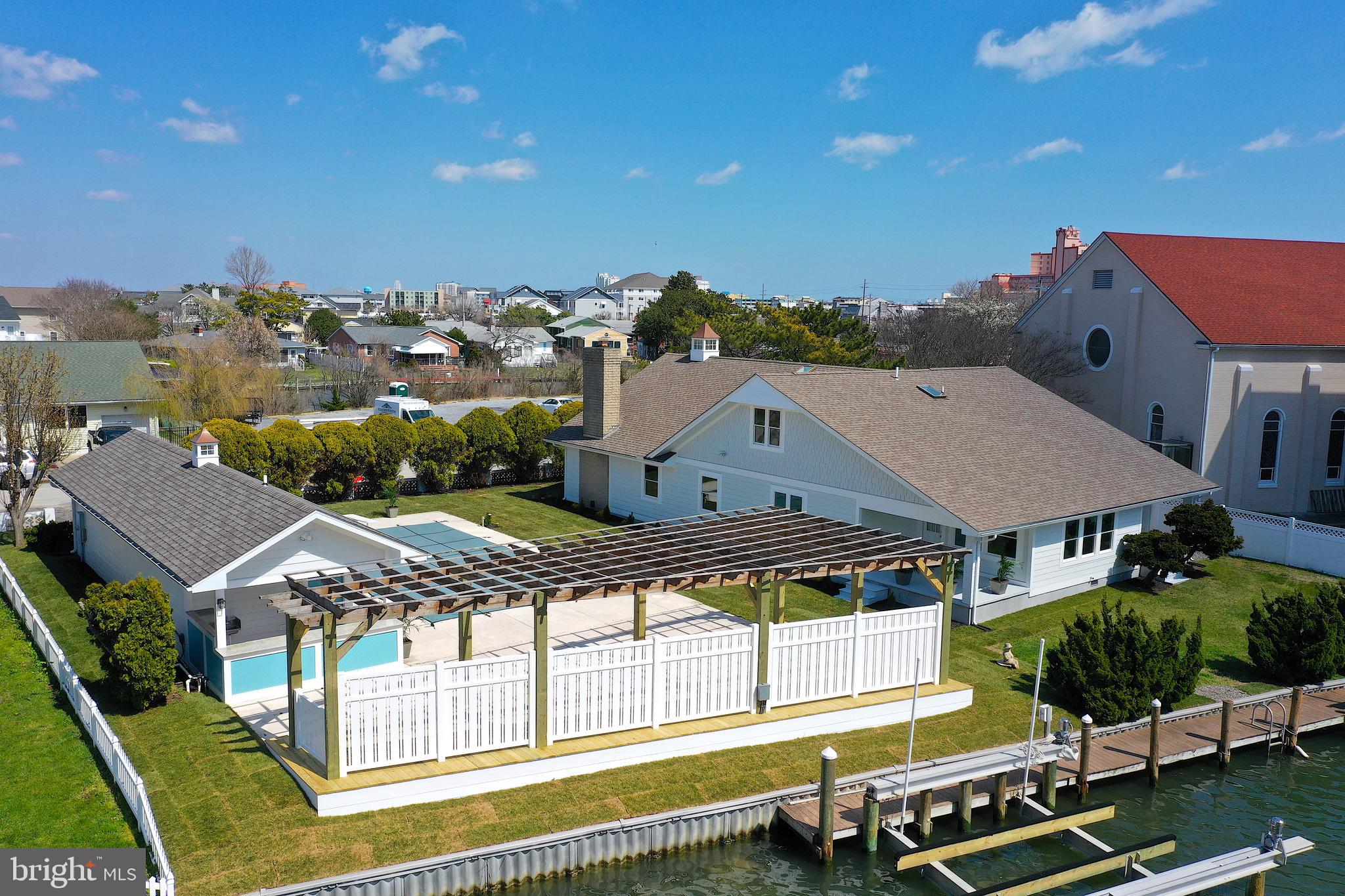 This incredible waterfront property in Downtown Ocean City combines two parcels of prime real estate into one amazing deal! Step onto the second lot and find a newly renovated pool area with a stylish pool house. Enjoy a deck for relaxation, a garage, outdoor kitchen, and two boat lifts for easy waterfront living.
Adjacent to the pool, the pool house/garage has also undergone recent renovations, boasting modern upgrades and finishes throughout. Here, you'll find a convenient full bathroom, a spacious garage, and an outdoor kitchen area perfect for dining and entertaining. Inside the main house, Six generously sized bedrooms and four full baths provide ample space for relaxation and rejuvenation. Whether you're hosting lively gatherings or enjoying quiet evenings with loved ones, this home offers the perfect blend of comfort and style.
Boating enthusiasts will delight in the convenience of not just one, but two boat lifts, ensuring easy access to the tranquil waters just beyond your doorstep. Two deep-water boat slips, meticulously designed to accommodate larger vessels with ease. Over 100 feet of bulkhead allows for no more marina fees , keep your yacht in your own backyard. Whether you're setting sail for a day of fishing, cruising along the coast, or simply enjoying a leisurely sunset cruise, it can all start from here.
This rare downtown location just 2 blocks from our world-famous boardwalk, mere steps or a leisurely bike ride away from the vibrant pulse of Ocean City, this residence offers unparalleled access to the town's finest offerings, including coveted front-row seats to the thrilling air show from you own backyard.
Don't let this rare opportunity slip through your fingers – seize the chance to own a piece of paradise in one of Ocean City's most sought-after locations!
No HOA- NO condo fees are just another added bonus!!