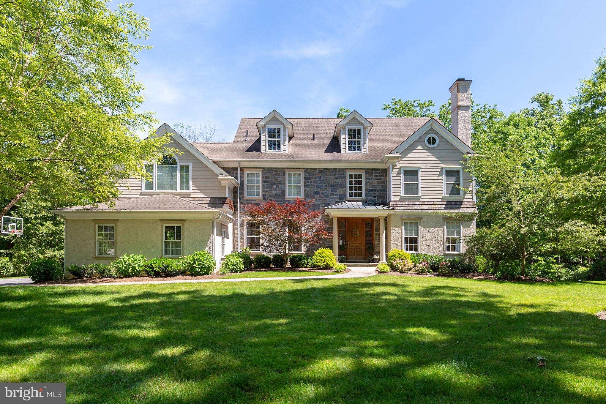 Built new in 2003, this exceptional luxury home has since been meticulously redone with the highest quality of design and craftsmanship. From the moment you enter the mahogany front door you will feel the quality of design and style throughout. Step inside to a soaring foyer with custom railing, wainscoting and loads of natural light. Beyond the foyer, you'll find the formal living room with gas fireplace, recessed lighting, hardwood flooring and more. The dining room offers a tray ceiling, custom moldings and large enough for those special family gatherings. The great room offers a dramatic vaulted ceiling with skylights, an impressive stone wood fireplace with loads of windows for natural light and beyond. The kitchen is exceptional. Renovated last year it includes custom cabinetry, a subzero fridge and freezer (under warranty) a Blue Star Range, Quartz counter tops and more. Both the kitchen and breakfast room are open and offer an exceptional floor plan with access to a built-in office hub, French doors to a stone patio and beyond a large mudroom with cubbies, closets, and powder room. Also, on this level find, an incredible first floor in-law/nanny suite, the perfect oasis for treasured guests to stay and a rear staircase to second level living quarters!Upstairs, find a luxurious master suite with vaulted ceiling, walk-in closet and incredible master bath with separate shower and tub in white marble. Other bedrooms include a princess suite with full bath and closet, a dedicated laundry room on second floor, and two more graciously appointed bedrooms which shared full bath with double vanity. Don't miss the walk-up attic access (3rd floor) a large floored space with windows and endless possibilities. The lower level is spectacular! It offers an 8-10 person home theater/movie room, a temperature controlled wine cellar/closet, a vast game room, a full bath, living room area with gas fireplace and adjacent mini-bar kitchen with French doors to rear yard. Perfectly located in south Devon on a quiet street, this property sits on a flat .76 acre lot and offers an attached 3-car garage and features the convenience of a walk to train, Devon yards restaurants/shopping and the famed Devon Horse Show all in award winning T/E School District. A must see to believe!