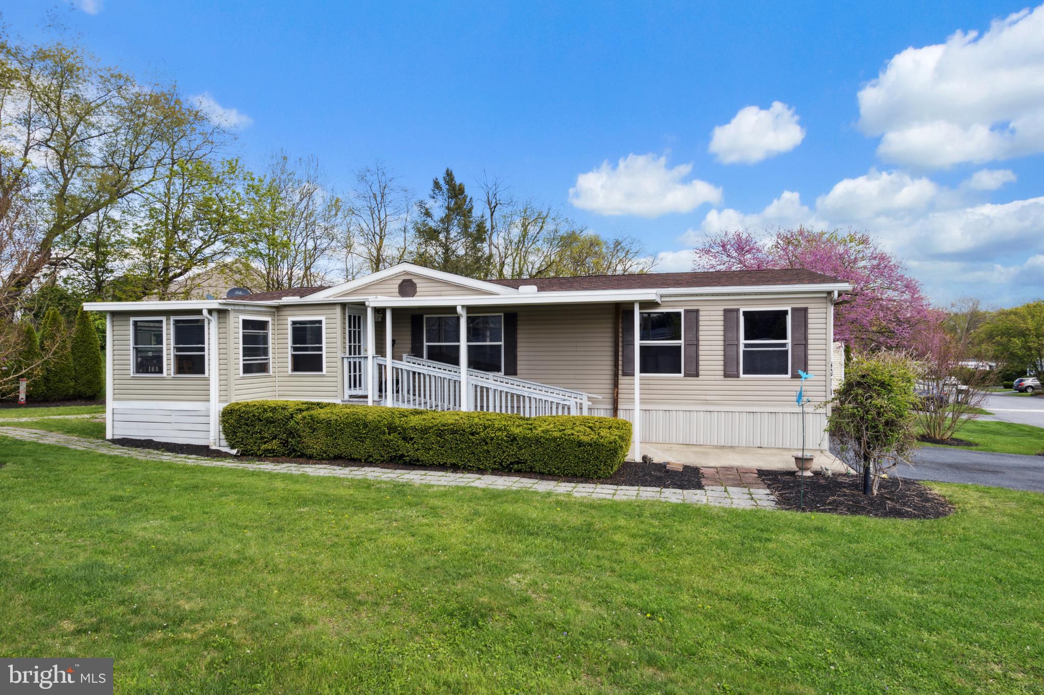 Why rent? Great opportunity to own this beautiful well maintained double wide mobile home with many upgrades in a desirable Hampden Twp park. Home has 3 beds 2 baths, large open kitchen/living room area with large island and plenty of storage. It is handicap accessible w/ ramp, roll in master shower and wide doors. Enjoy the three seasons room overlooking beautiful landscaping on an ample sixed lot with a large shed for storage. Many upgrades include-new roof 2017, enclosed porch into a three seasons room 2018, wood flooring throughout the living room and primary bath 2016, Built an island 2016, replaced the heat tape/insulation 2023. The property is located in CV schools and close to amenities and major routes. Trash/sewer included in lot rent. Pets allowed for small fee. No rentals allowed.