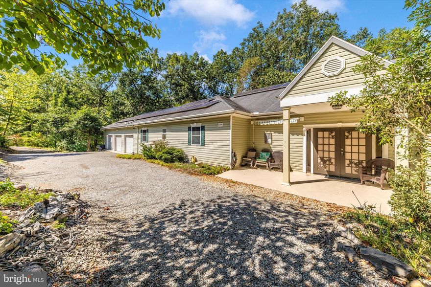Offered at $25,000 Below 2024 Assessed Value  Just minutes from Route 70 and a scenic 20-minute drive to Green Ridge State Forest, this expansive 6-bedroom, 5-bathroom home rests on 3.8 acres of tranquil woodland—plus an adjoining 2.16-acre lot of record just down the road for added privacy or future potential. Nature at Your Doorstep   Located less than a mile from the C&O National Historical Park and Little Pool Lake, you’ll enjoy direct access to: Paved biking trails, The C&O hiking trail along the Potomac River features: Fishing, wading, and boating opportunities Built to Endure: Insulated Concrete Form (ICF) Construction.  This home is a fortress of durability and energy efficiency, constructed with 8" thick reinforced concrete walls wrapped in over 2" of Styrofoam insulation on both sides—totaling 12" of strength and thermal protection.  ICF homes are often called “1000-year homes” for good reason. They resist: Tornado-force winds, Termites, and insects Moisture, rot, and fire.  For a real-world example of their resilience, see Florida’s Mexico Beach Survivor. Outdoor Serenity   Enjoy your own private trail and three peaceful ponds—one stocked with goldfish and one with a remote controlled fountain—right in your backyard. Additional green space across the street and a wooded lot down the road enhance the sense of seclusion. Zoned for environmental conservation and adjacent to the Western Maryland Sportsmen’s Club preserve, the surrounding forest is protected by platted conservation easements. Spacious & Thoughtfully Designed Interior.  Vaulted ceilings in the kitchen, dining, and living areas create an open, airy feel.  9' ceilings throughout the rest of the home maintain that spacious vibe. Two full-length (100-foot) patios/balconies on both levels offer stunning views—ideal for entertaining or peaceful mornings 
Owner’s Suite Retreat.  Oversized bedroom with a luxurious master bath, Whirlpool tub, walk-in shower, private toilet room, Two large walk-in closets—one with in-unit washer/dryer Comfort & Efficiency.  Zoned heating and cooling with separate AC units and water heaters for each side of the home.  Versatile Walk-Out Basement.  Large game room with pool and ping pong tables.  Kitchenette, 3 additional rooms, full bath, rough-in for another. Workshop and abundant storage space Additional Features: 3-car garage, All furnishings and items shown in photos included . Whether you're dreaming of a private sanctuary or a turnkey Airbnb investment, this property delivers unmatched space, privacy, and access to nature—all in a prime location.