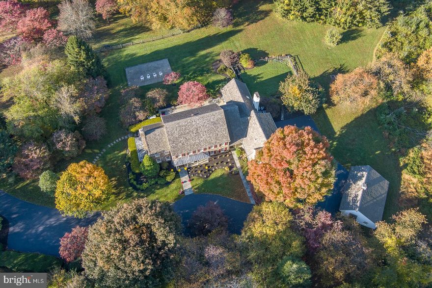 Welcome to 847 Providence Rd, an incredible 51+ acre property ideally situated directly across from Radnor Hunt Club in the desirable Willistown Township. This gorgeous, custom-built E. B. Mahoney home, designed by the acclaimed architect Ann Capron, offers a perfect blend of simple elegance, thoughtful design, and serene surroundings, making it an ideal haven for comfortable living. 

The minute you turn into the driveway, you know you are somewhere special. You’ll be captivated by the spectacular setting with open fields, lush fenced pastures for your horses to graze, and mature woodlands offering loads of privacy. For equestrians, this location doesn’t get any better with numerous riding trails. This property is protected with a conservation easement through the Willistown Conservation Trust. 

A flagstone walkway leads to the welcoming front entrance of this home. Enter into an inviting and spacious foyer with cathedral ceiling and turned staircase to the second floor. The main level of this home features formal Living and Dining rooms, a Home Office/Den and lots of sunlight creating a bright and airy feel. The hardwood floors flow seamlessly throughout the living spaces adding natural beauty and warmth.

The heart of the home is the Kitchen, equipped with high-end stainless appliances, an abundance of cabinet space, granite & Corian countertops, a large center island with Breakfast Bar, and a full Butler’s Pantry. Adjacent to the Kitchen is a lovely Breakfast room, open to the Family Room, with skylights and sliding glass doors leading to the oversized flagstone patio. The Family Room with vaulted ceiling and skylights, is a comfortable and inviting space to relax and entertain guests, or to simply gather around the cozy fireplace.

On the second floor of this wonderful home are four well-appointed Bedrooms, including a lovely Primary Bedroom with en-suite Full Bath. The Primary Bedroom features deep-set, custom built-in cabinetry and two walk-in closets. In the Primary Bath, there is a double sink vanity, soaking tub and separate shower. Also on this floor are three additional Bedrooms, one with en-suite Bath, walk-in closets, lots of natural light, and a Full Hall Bath.

Other highlights of this home include two Mudrooms with built-ins, a first floor Laundry Room with laundry chute, a walk-in cedar closet with access to an Apartment located over the attached three-car Garage with Living Area, Kitchenette, Bedroom, walk-in closet and Full Bathroom. There is also a detached three-car Garage for car enthusiasts and plenty of parking. The large, unfinished Basement, and unfinished walk-up Attic could easily be finished to create additional living spaces for your enjoyment. Five-zone heating/cooling with four air-handlers, and a back-up generator are just a few additional special features of this home. There is also a run-in shed for your horses with tack room, and a fenced area for dogs. A large gravel area, ideal for your firepit and chairs, is the perfect spot to enjoy the outdoors with family and friends year-round.

There is potential for one subdivision. The Willistown Conservation Trust agreement will allow for one home to be built on the subdivided lot. Buyers are responsible for their own due diligence.

This special country property is within close proximity to urban conveniences offering the best of both worlds. It is minutes to Malvern Borough, West Chester and Newtown Square with shops, restaurants, and entertainment, and has easy access to major transportation routes, Paoli Train Station, Philadelphia Airport, Philadelphia, & other neighboring cities. Award-winning Great Valley Schools & multiple private schools in the area.

Don't miss the opportunity to make 847 Providence Rd your new home where you can enjoy a unique lifestyle, a stunning residence with exceptional, quality craftsmanship, and the beauty of your tranquil surroundings.  Come experience what this amazing property has to offer.