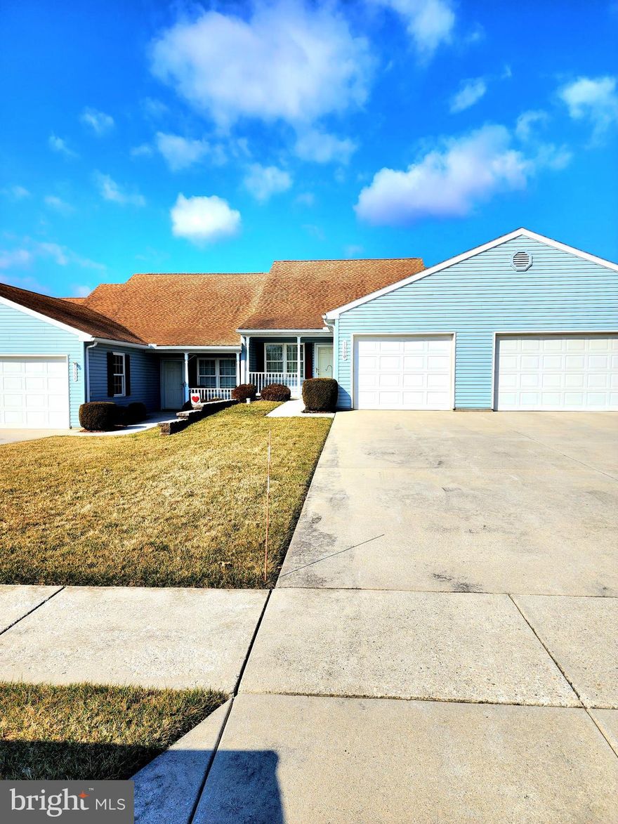 Wonderful 55+ community in Spring Grove!  Move right in with nothing to do - no more mowing or snow removal!  Fantastic 2 bedroom, 1 full remodeled bath with walk-in shower with a glass door.  New luxury vinyl Pergo has been installed in the living room/dining area and hallway back to the bedrooms. Heat pump and A/C replaced less than 3 years ago.  A french door in the second bedroom leads to a nice patio to enjoy the weather, or sit on the front porch and enjoy the quiet neighborhood.  The kitchen is amazingly large with tons of counter space and cupboards for all your needs.  Both bedrooms have double closets for amazing storage.  Washer and dryer tucked away in their own room off of the living room.  Come check this one  out today!