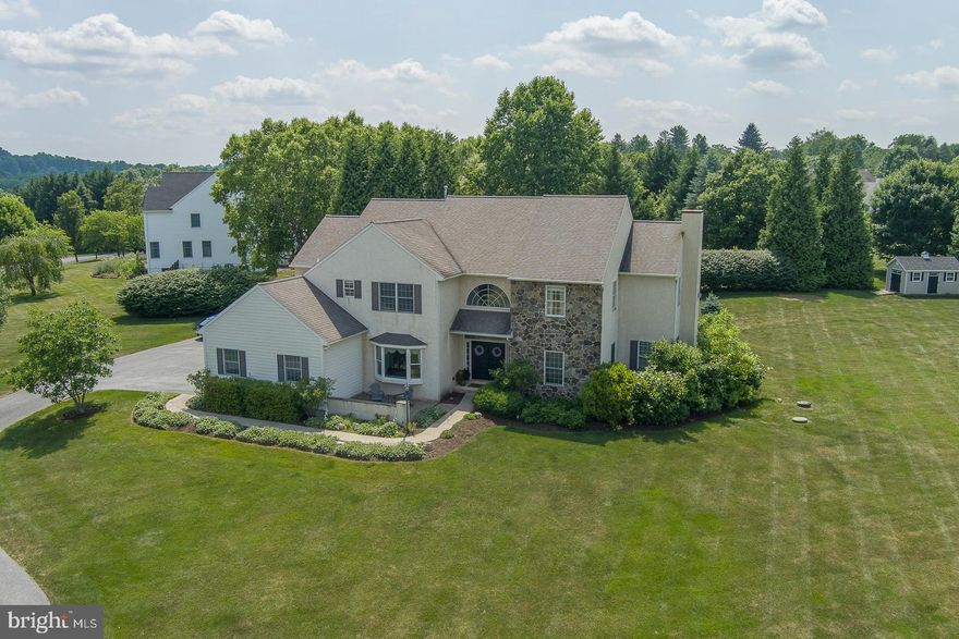 Welcome to 121 Waterview Drive    a spectacular custom built home situated on a premium 1.4 acres in the community of "Chalfant St. Giles" overlooking beautiful Marsh Creek State Park. Over 4,400 square feet of fabulous living space on the first two levels plus 1,900 square feet of additional living space in the professionally finished Lower Level. Featuring 4 Bedrooms, 4 full Baths and 1 half Bath, this beautifully appointed home offers numerous amenities and updates including a full house Generator, new professional landscaping and expansive hardscaping (2020), new carpeting (2023), fresh paint (2024), new bathroom vanities (2024) and much more! 1st Floor features an inviting 2-story hardwood Entry Foyer with a butterfly staircase; spacious and bright private Study w/double French doors; Living Room with gas Fireplace and doors leading to the covered Deck; formal Dining Room with chair rail, crown molding and bay window; large Eat-in Kitchen & Breakfast Room with granite countertops, center island, commercial grade Jenn-Air cooktop, Butler’s Pantry Area, back staircase to the Upper Level and sliders to the open rear Deck and Bluestone Patio; vaulted Family Room features fabulous bright windows & floor-to-ceiling woodburning stone Fireplace; Powder Room and convenient Laundry/Mud Room with exit to 3 car garage complete the Main Level. 2nd Floor offers a luxury Primary Bedroom Suite with separate Sitting Room, large walk-in closet & Primary Bath featuring soaking tub, double sinks, stall shower & dressing area; 3 additional Bedrooms    including one Bedroom with a private ensuite Bath & new vanity and two Bedrooms sharing a connecting Bathroom with tub/shower combo & new vanity. The finished Lower Level features luxury vinyl plank flooring, a spacious Exercise Room or 2nd Home Office, Game Room Area, Media Room/Home Theatre, full Bath & plenty of storage. The Outdoor Living Area features a magnificent yard with two separate deck areas, including one covered Deck, plus an expansive Bluestone Patio. Only steps away from gorgeous Marsh Creek State Park offering boating, fishing, hiking and beautiful sunsets. Don’t miss this rare opportunity to own a fabulous home in the award-winning Downingtown School District offering the coveted STEM academy. Conveniently located to the PA Turnpike, major commuting routes, shopping, restaurants, schools and parks.